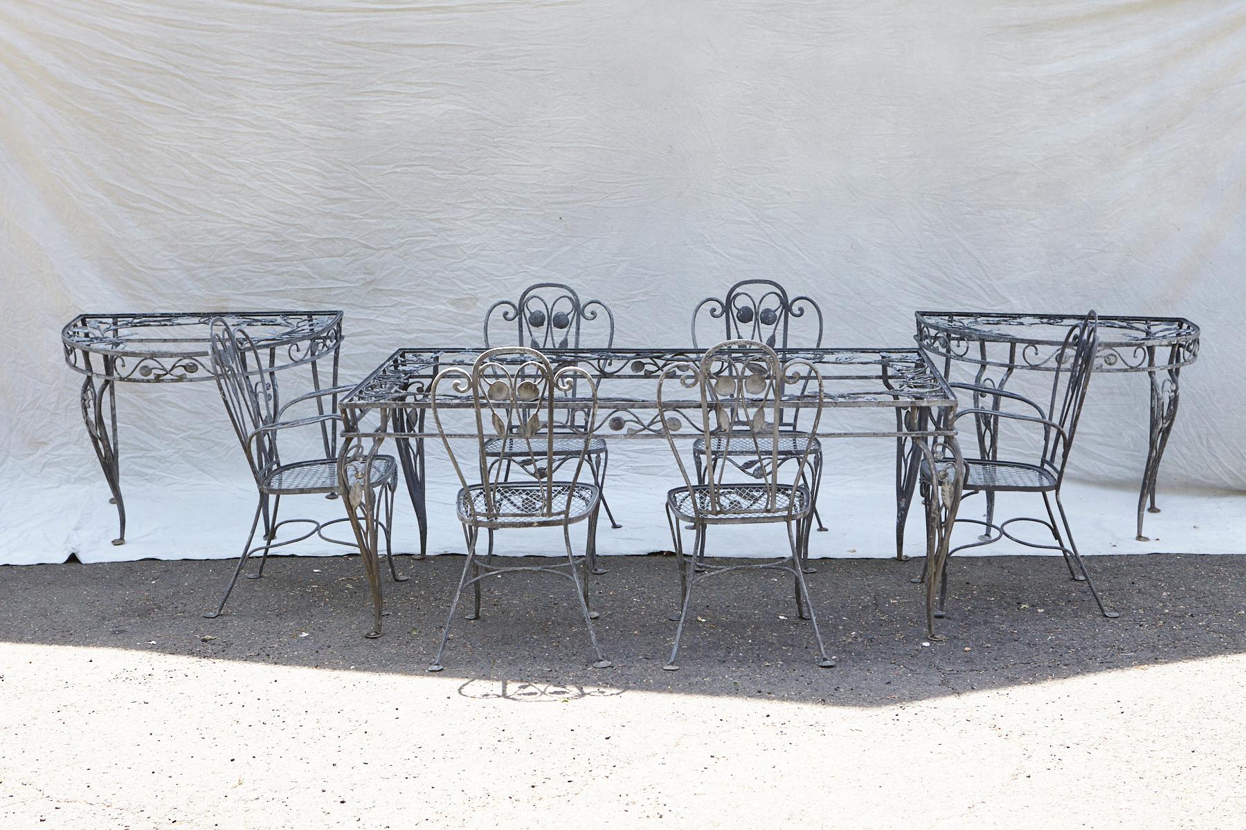 A rare Salterini elaborate wrought-iron dining set, consisting of a dining table, two demilune consoles or extensions for the table and six chairs ( two armchairs, four side chairs) from his Della Robbia Collection / Group from the 1940s.
The