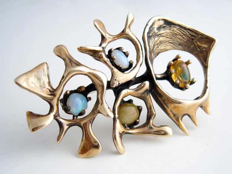 Important one of a kind 14k gold and opal brooch created by San Francisco jeweler Sammy Gee, circa 1950.  Brooch measures 1.5
