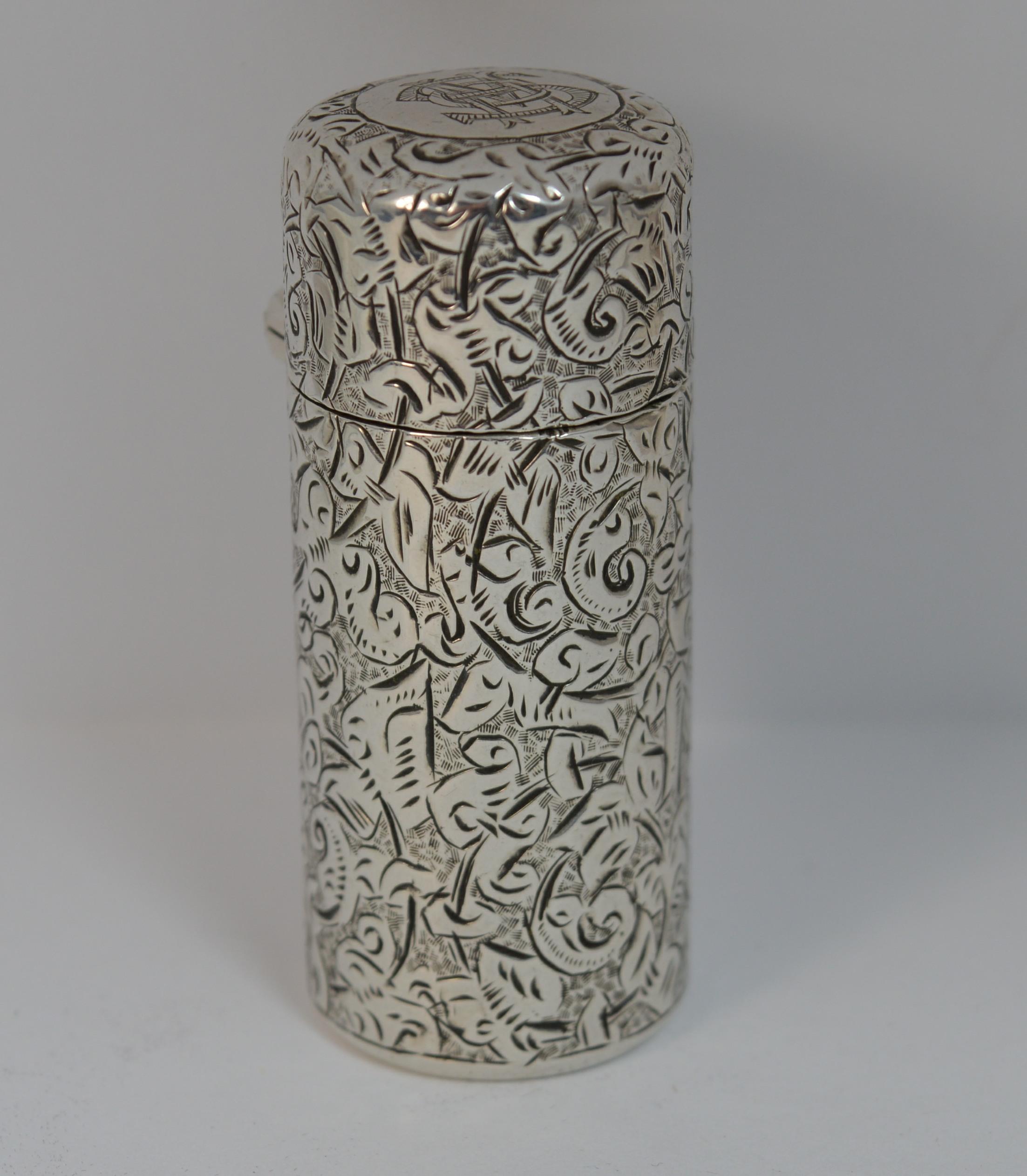 A superb antique solid Silver scent bottle.

Sampson Mordan and Co.

Fine hand engraved pattern throughout.

Tube or cylnder shape.


Hallmarks ; lion, SM & Co, London assay, all quite worn

Size ; 22mm diameter, 55mm long

Weight ; 54.6
