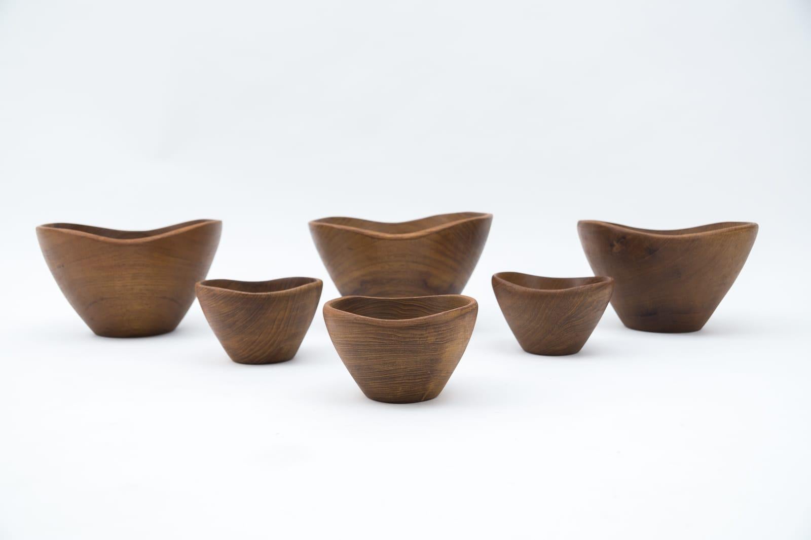 Rare Scandinavian set of six teak bowls, 1960s.

The small bowls height 9cm, diameter 14.5cm.
The large bowls height 13cm, diameter 24.5cm.
