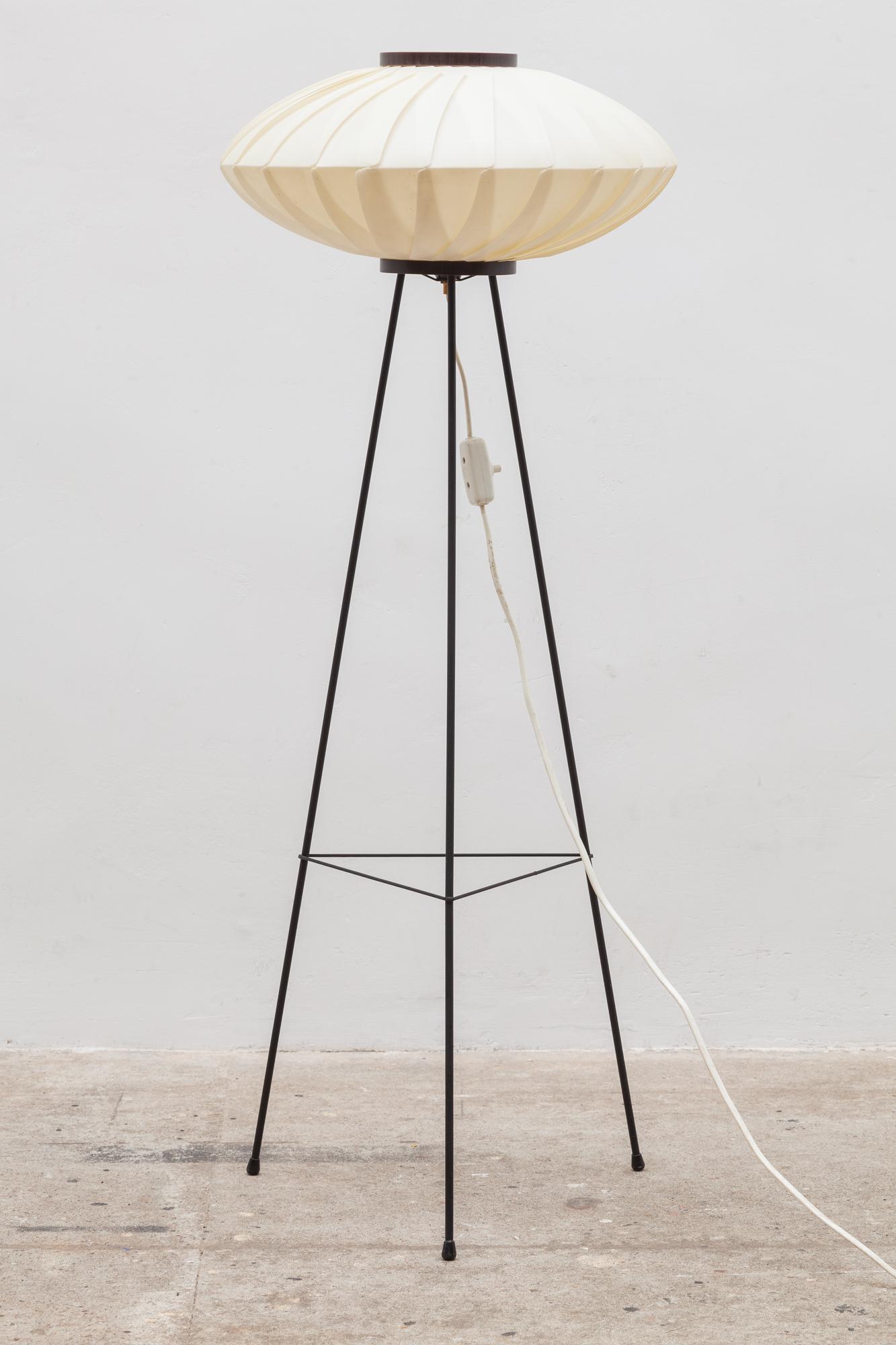 Floor-lamp attributed to ASEA in Sweden during the 1960s. Cocoon sprayed hand folded acrylic shade. Very good vintage condition.The tripod is made out of black lacquered steel.