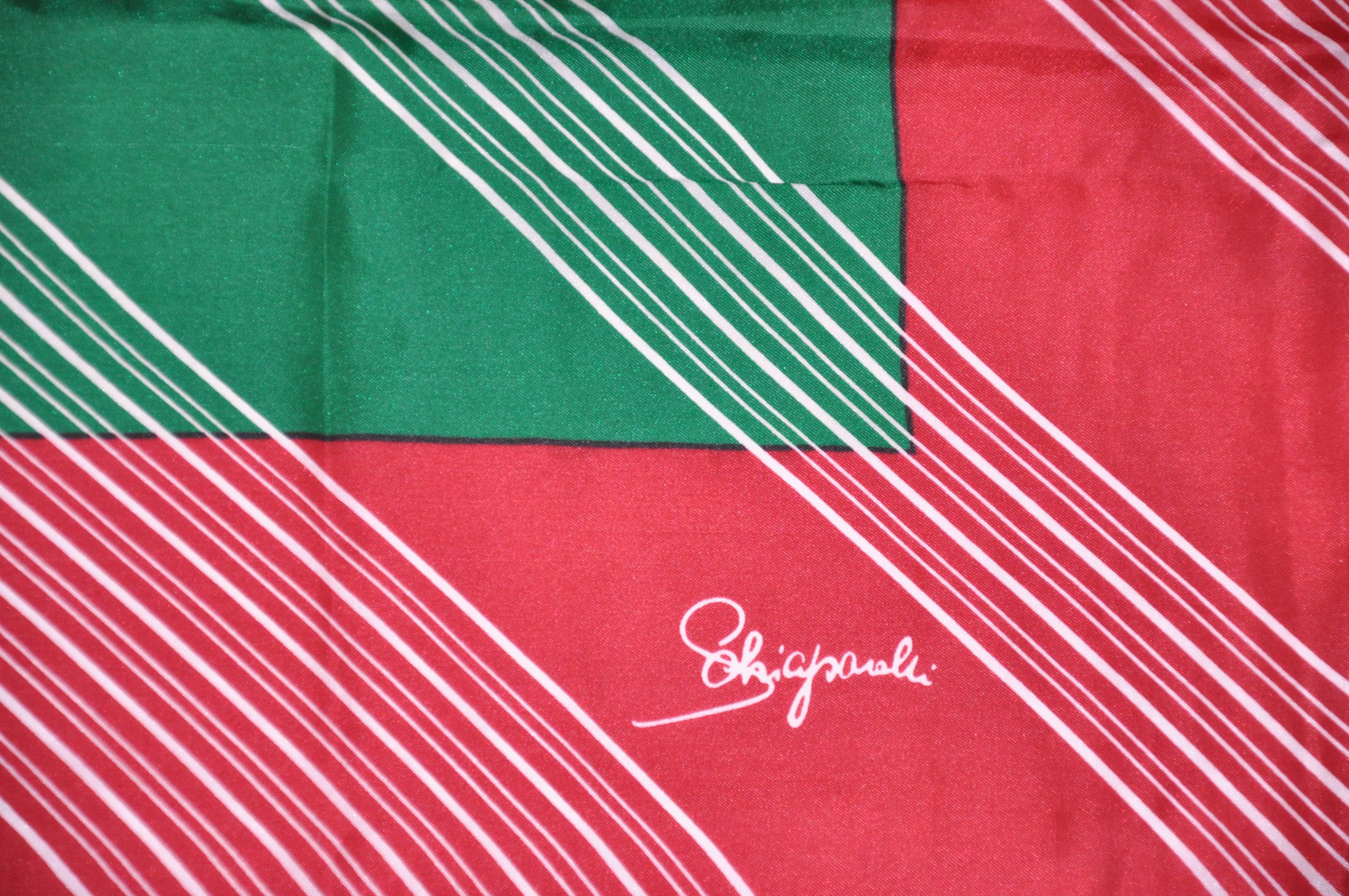       This rare Schiaparelli multi color silk scarf is detailed with multi stripes and finished with hand-rolled edges. This silk scarfs measures 28 inches by 28 1/2 inches. Made in France. 