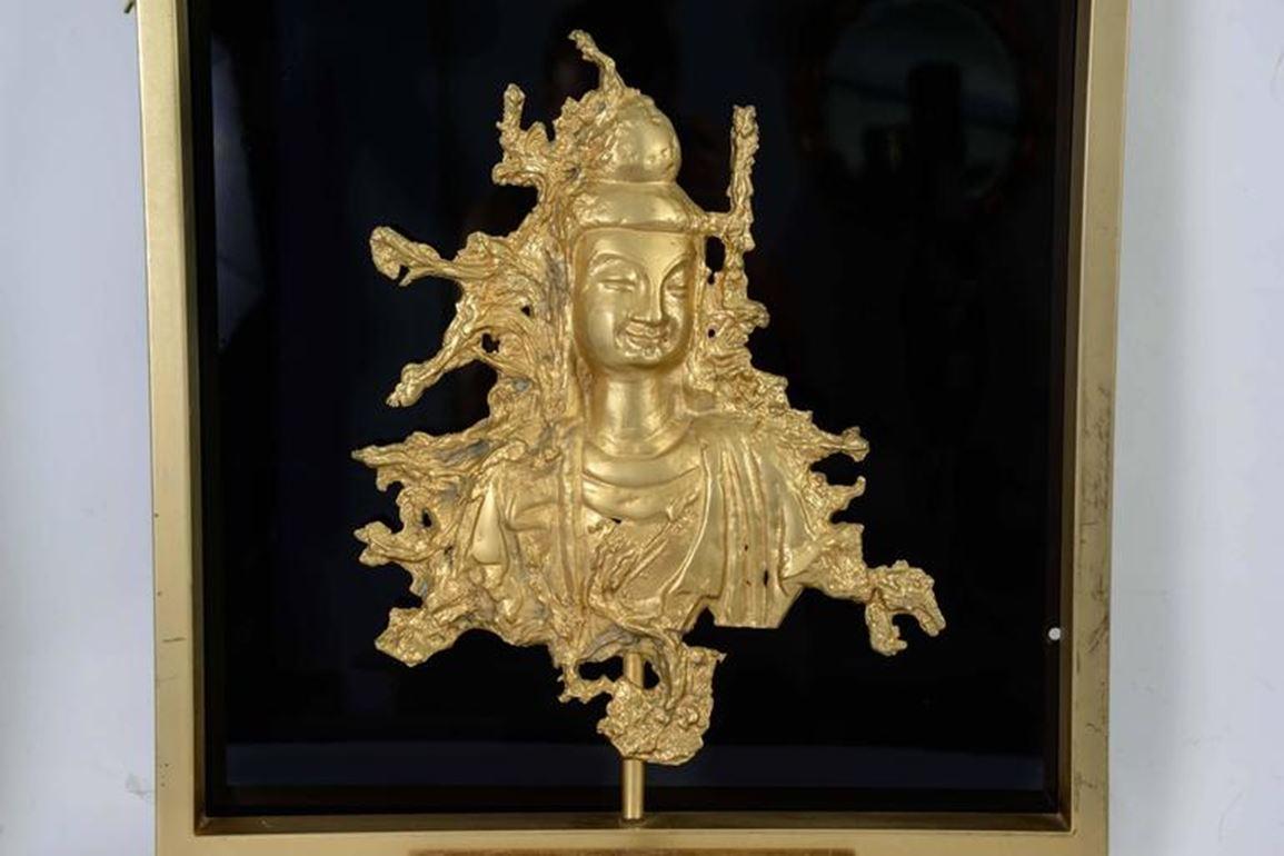 Rare sconce in bronze and gilded brass with Angkor decor and  Buddha figure 
Bottom panel in black wooden lacquered.
Maison Guerin, Paris,
circa 1970.

