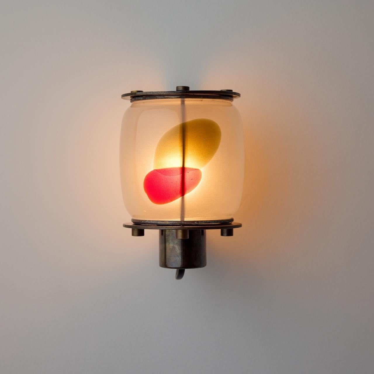Two Rare Sconces by Paolo Venini (IT, c. 1960s)

Visually striking art glass sconces featuring a stout etched glass capsule with an abstract color inlay. Two sconces feature a similar pattern and the third features an entirely separate color-way and