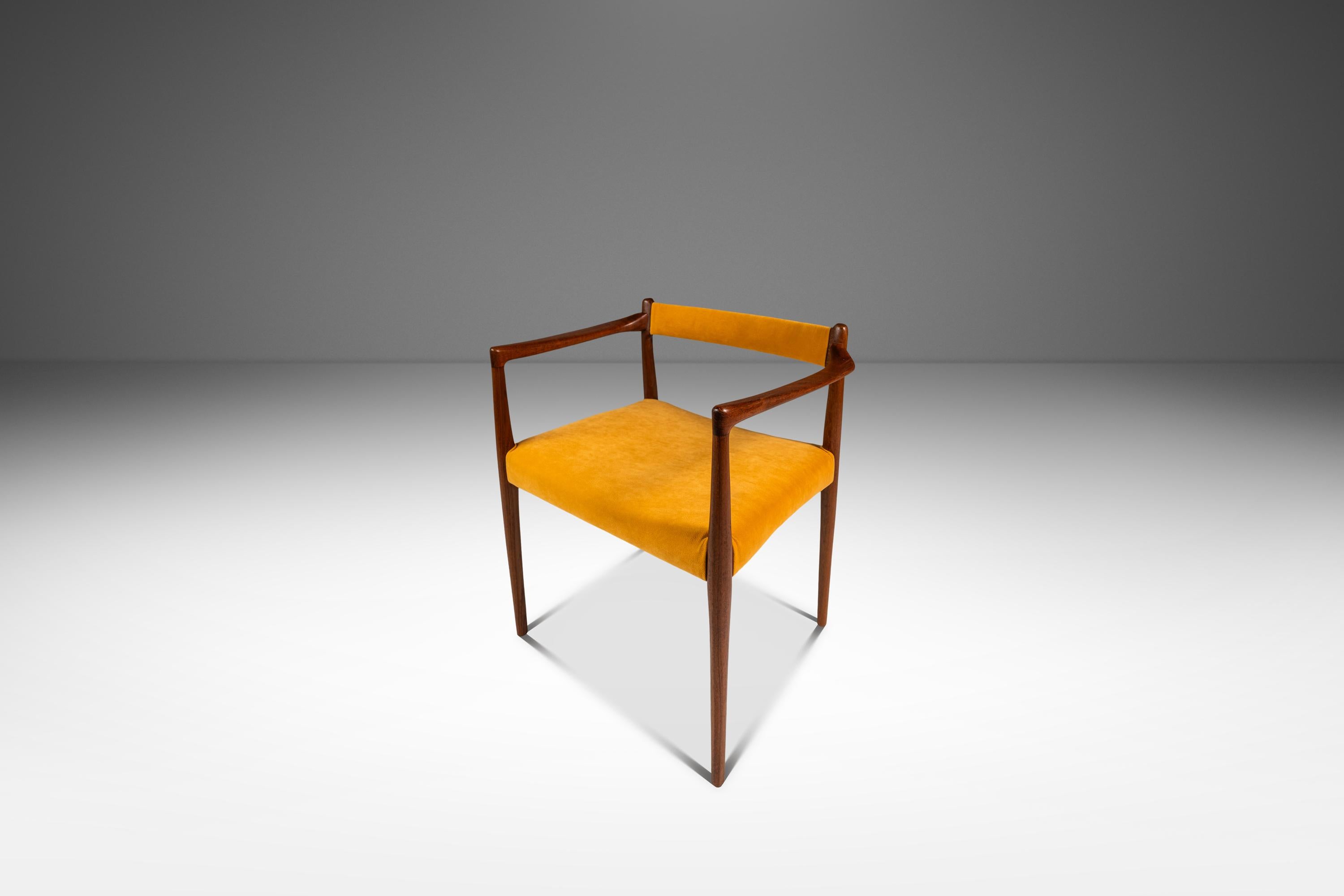 Introducing an incredibly rare armchair designed by the incomparable Helge Vestergaard Jensen. Constructed from a frame of solid Burmese teak and replete with variegated woodgrains and intricate joinery this artfully designed and crafted armchair