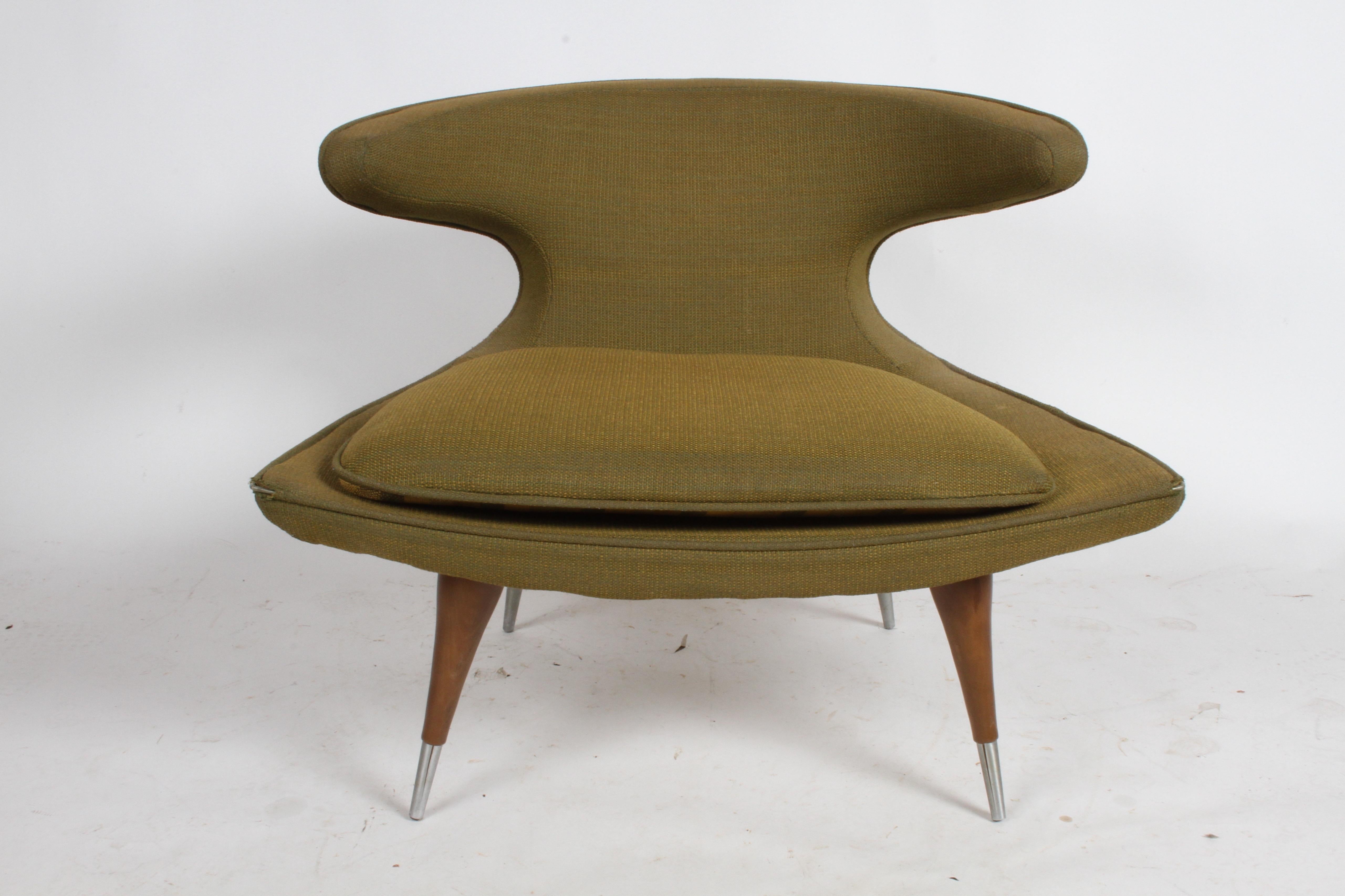 The horn chair, one of the best designs by Karpen of California, a very iconic midcentury form. This lounge chair is all original, fabric is in need of updating, structurally fine. Steel sabots have some splitting. Retains label. A Rare and hard to