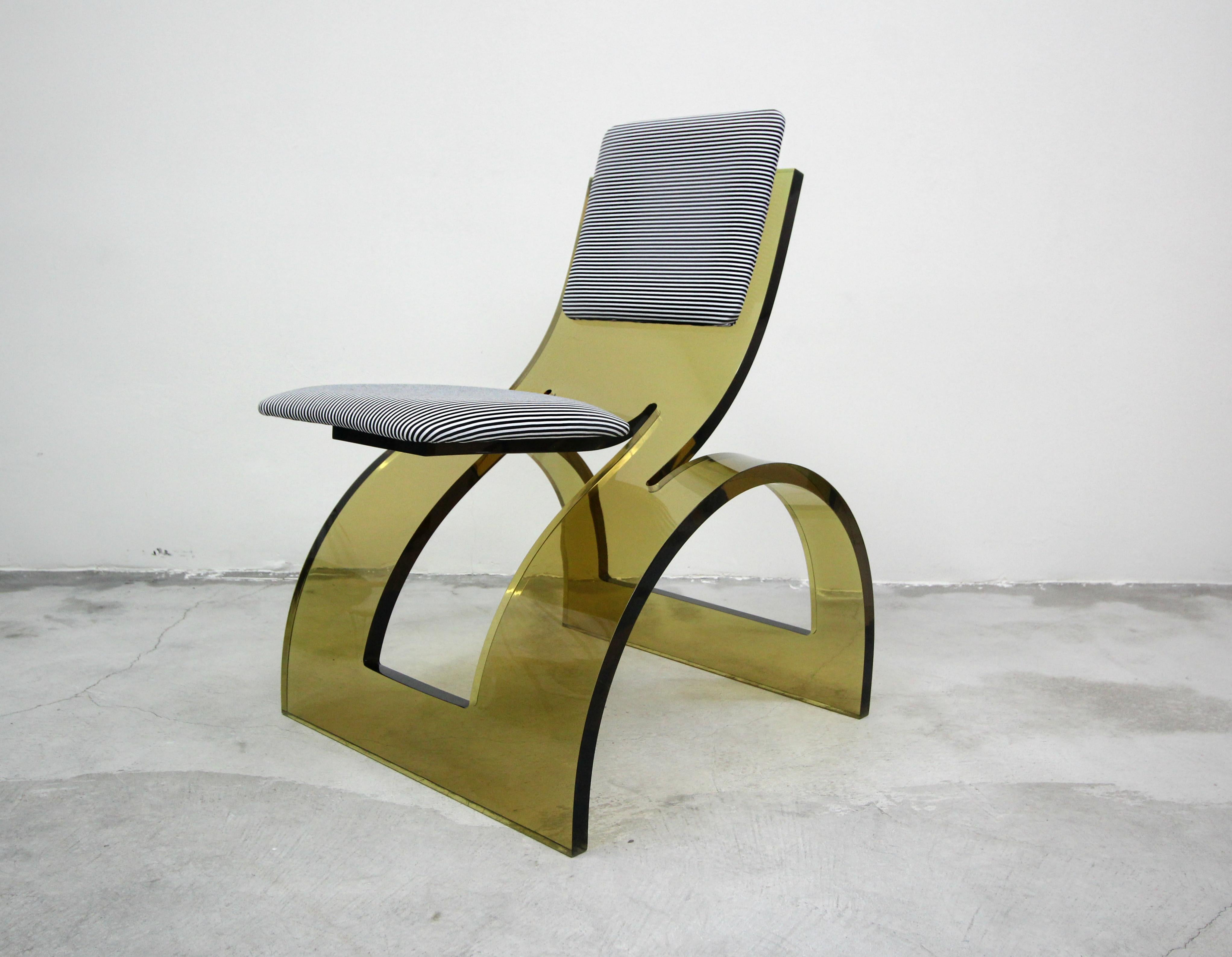 A work of art, a true perfect one off. This rare sculptural cantilevered vintage arched colored Lucite corner lounge chair makes a true statement. Representing form and function, a unique example of vintage Lucite with its incredible arched base and