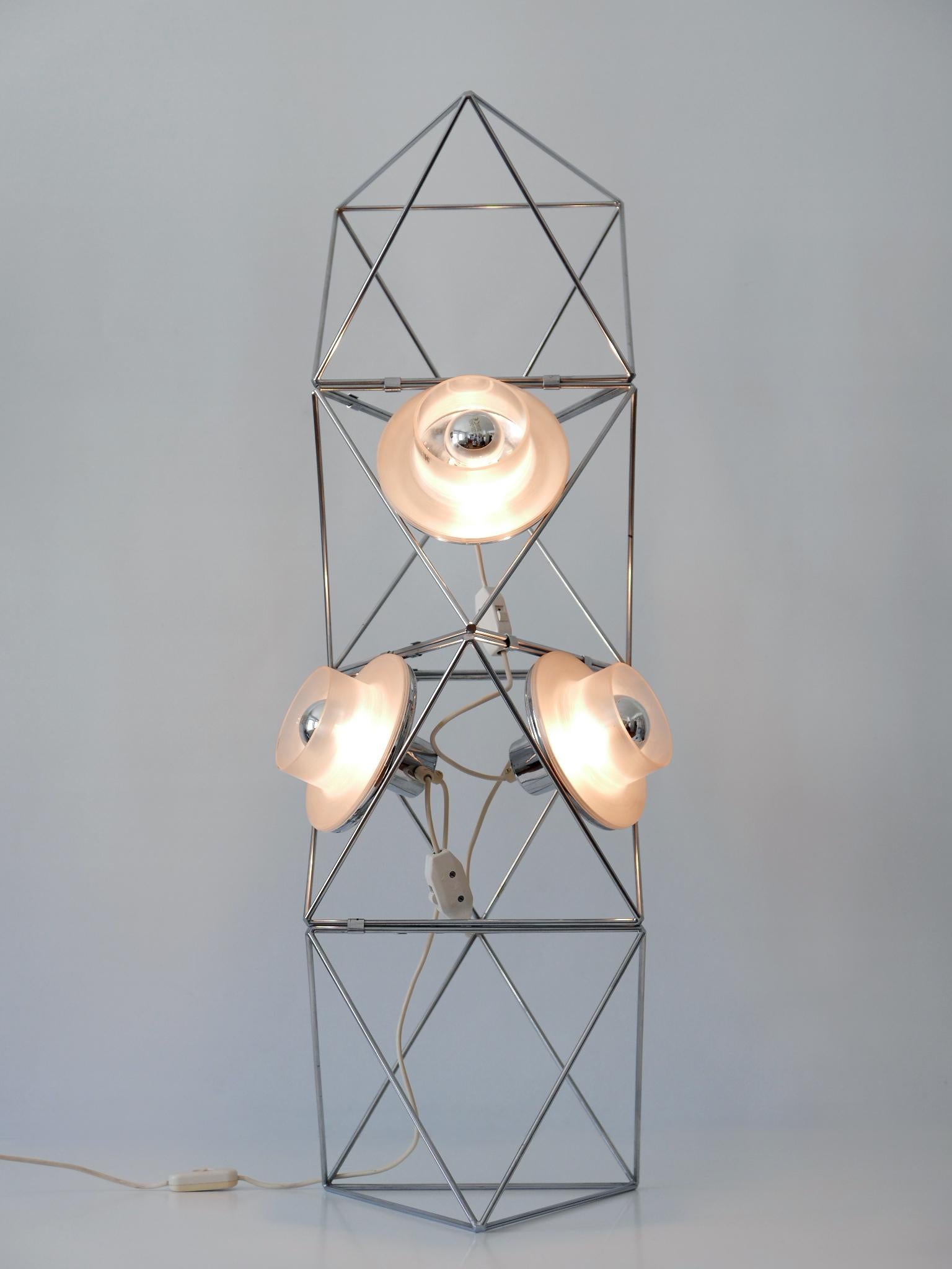 Sculptural Mid Century Modern 'Poliedra' floor lamp. The floor lamp consists of four modular elements that are characterized in geometry as polyhedra and can be combined into different shapes due to the metal clips which hold the elements.