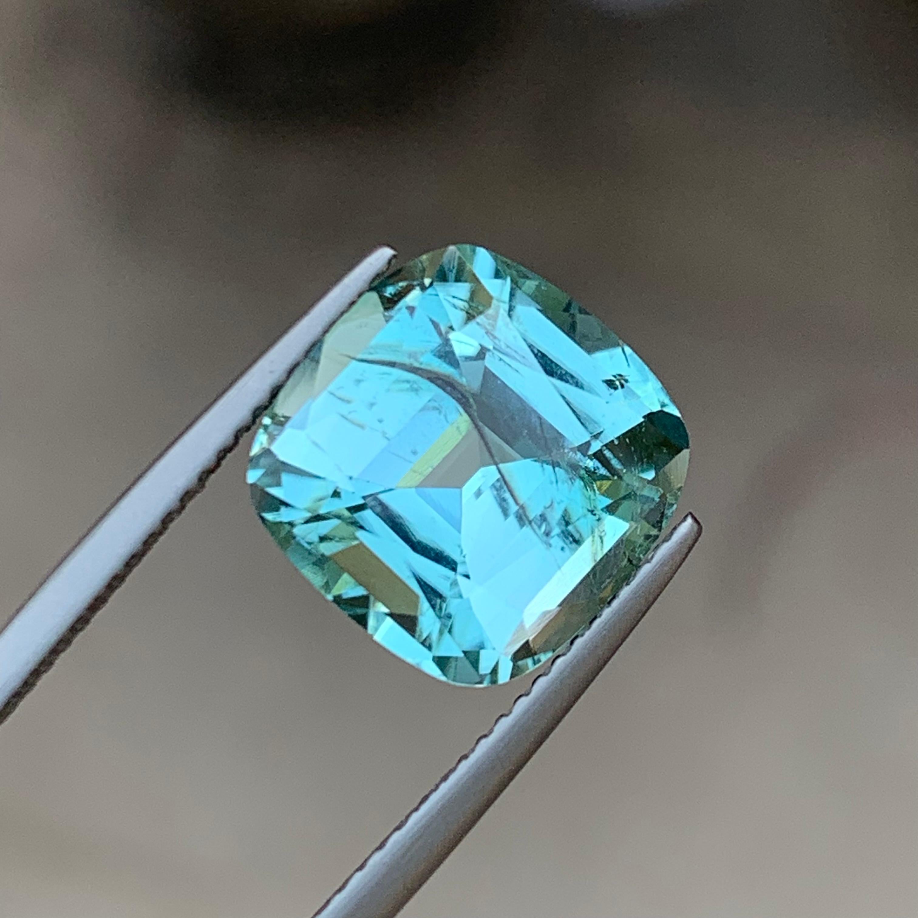 GEMSTONE TYPE: Tourmaline
PIECE(S): 1
WEIGHT: 7.75 Carats
SHAPE: Square Cushion 
SIZE (MM): 12.11 x 12.11 x 7.70
COLOR: Seafoam Blue
CLARITY: Slightly Included 
TREATMENT: None
ORIGIN: Afghanistan
CERTIFICATE: PEW2404540933

Truly magnificent 7.75