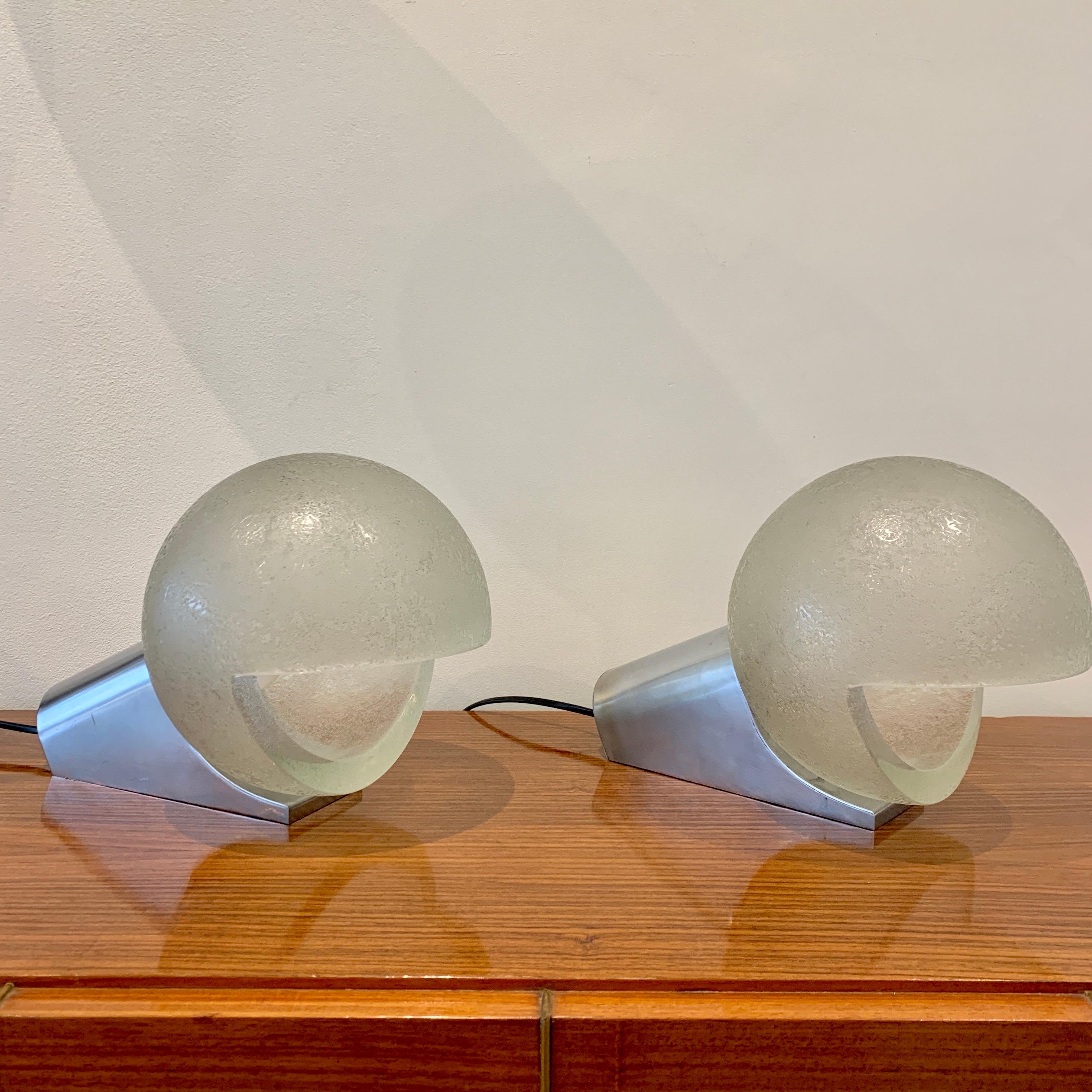 Seguso is famous Glass workshop active in Murano. They created glass masterpieces throughout the twentieth century. The pair of lamps is listed as model 14462 (see photo). The present model is handmade. The glass is handmade, blown, and then worked
