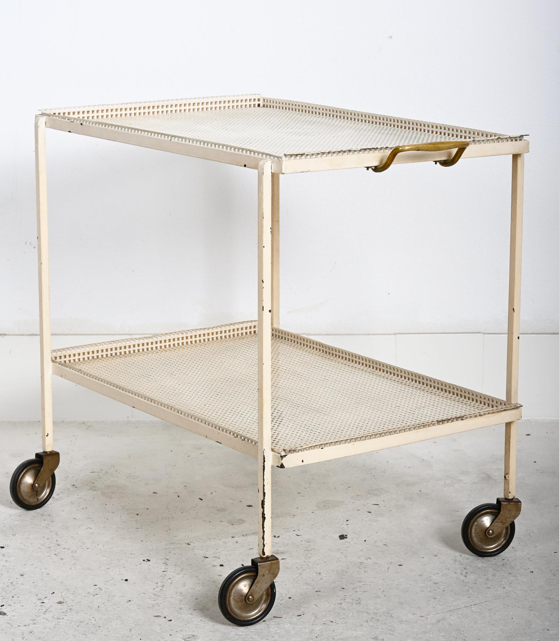 Steel frame white painted on 4 weels and two perfored shelwes. Made by J.T. Kalmar in the early 1950s. According to Kalmar the cart was never in production and only few pieces are available. Original unrestored condition. 