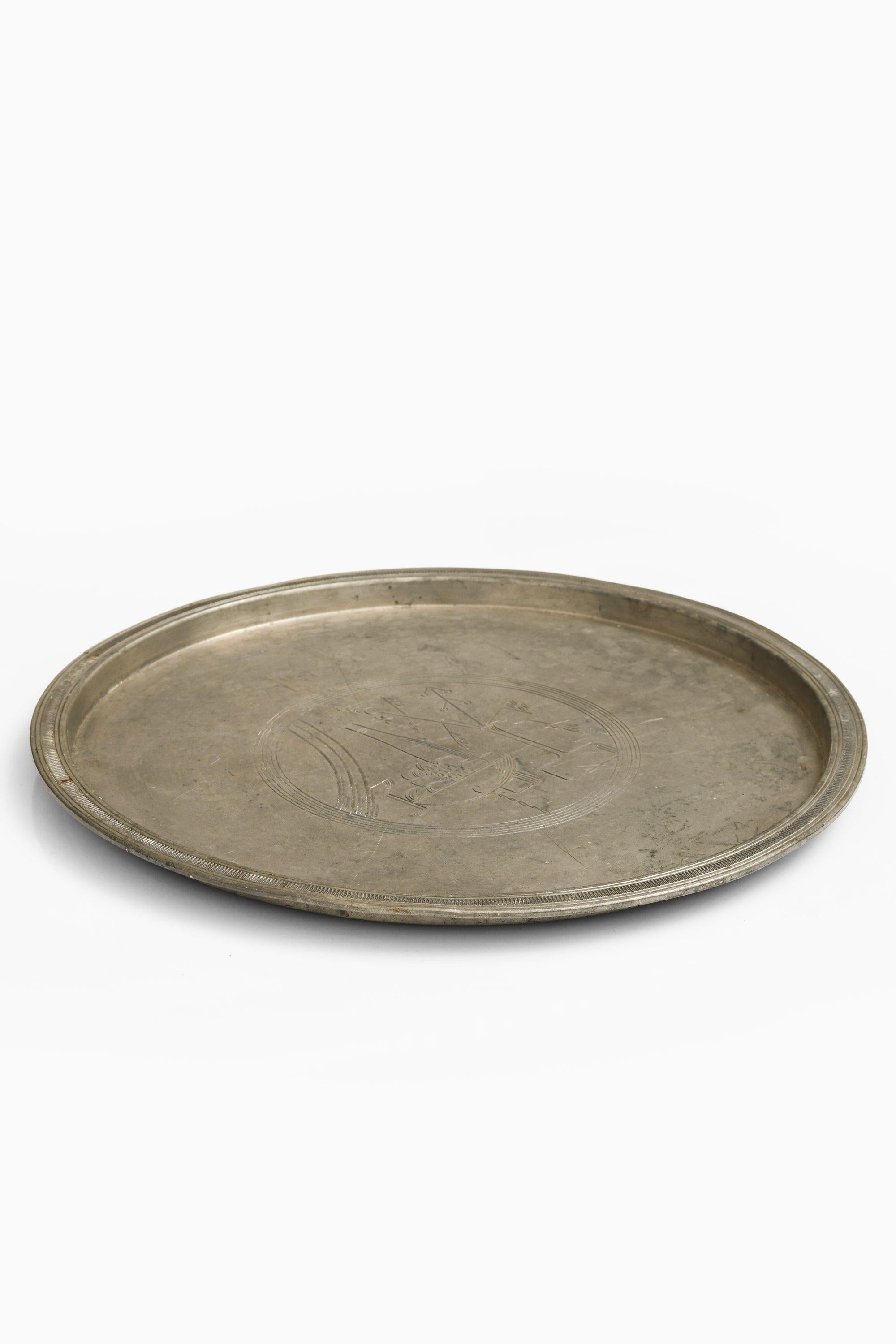 Rare Serving Tray in Pewter by Sylvia Stave, 1934

Additional Information:
Material: Pewter
Style: Mid century, Scandinavian
Produced by C.G. Hallberg in Sweden
Dimensions (W x D x H): 29 x 29 x 1.5 cm
Condition: Good vintage condition, with signs
