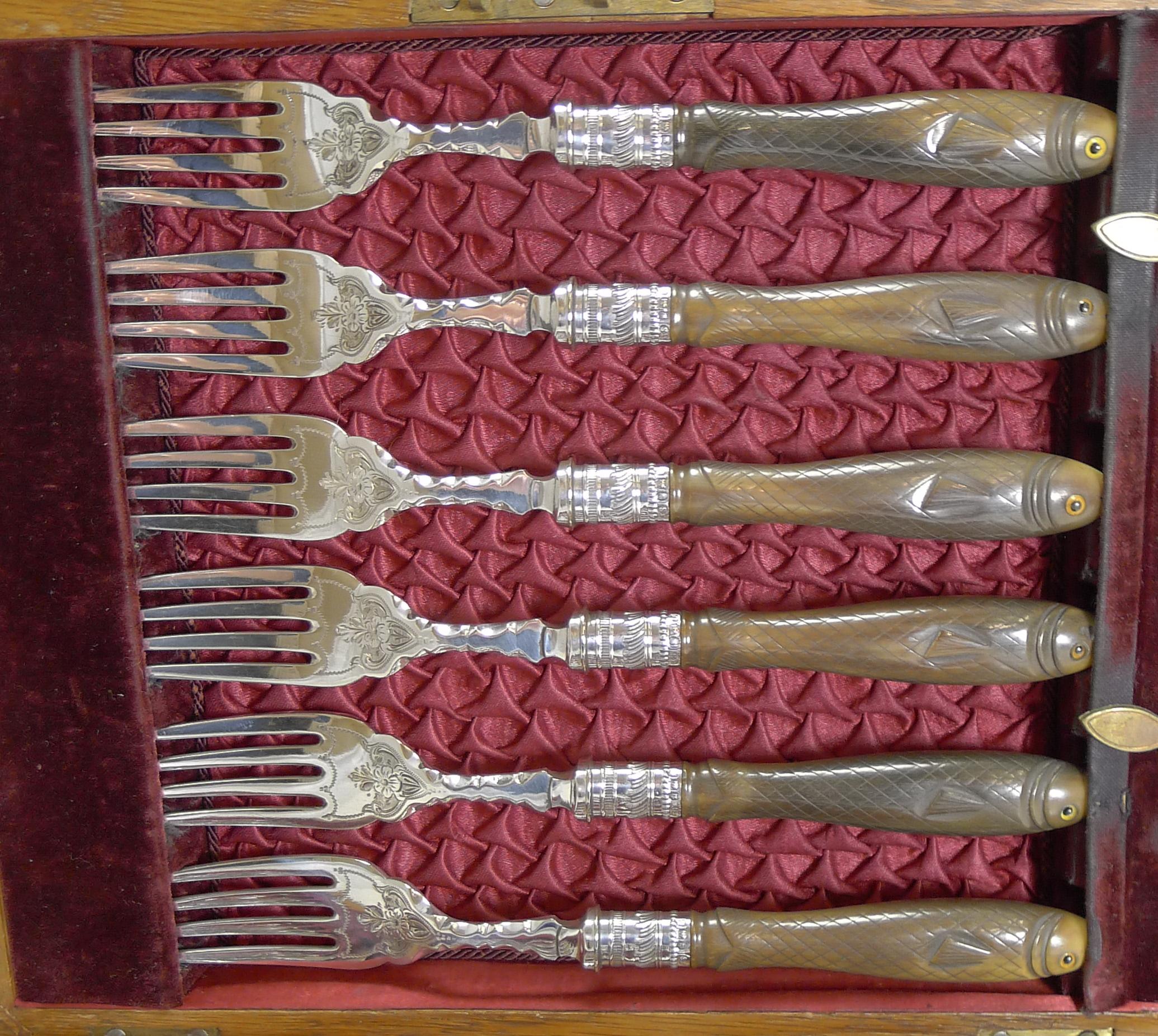 A wonderful set of fish knives and forks for six; what of course makes these rare are the magnificent hand carved handles in horn in the form of fish, each sporting the original glass eyes each side of every handle.

Complete in their original