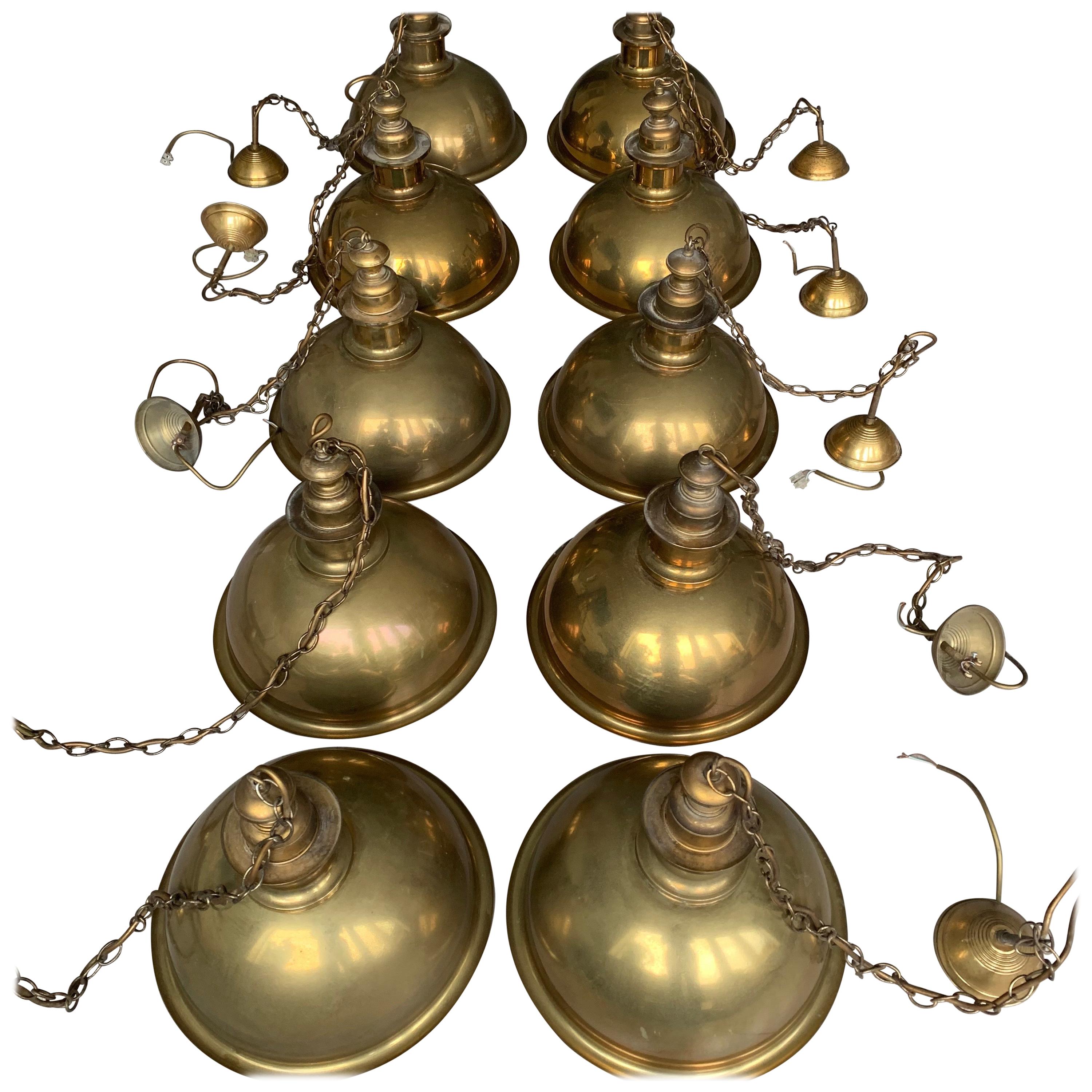 Marvellous, perfect size and shape pendants from the midcentury design era.

These very stylish 1970s light fixtures come with all the original brass canopies intact. They are in a good / used condition and the beautifully patinated brass shades are