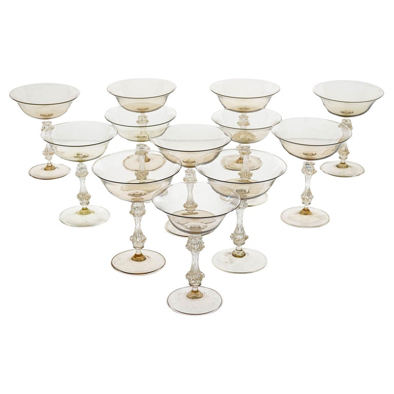 https://a.1stdibscdn.com/rare-set-of-12-classic-cenedese-fume-and-gold-champagne-glass-unique-for-sale/f_25683/f_365266021696856110816/f_36526602_1696856111372_bg_processed.jpg?width=768