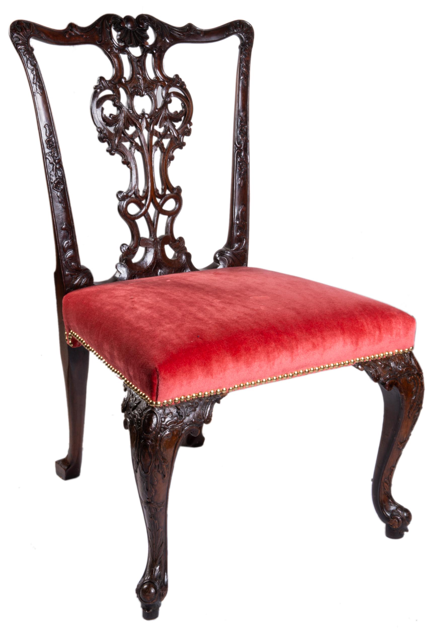 A fine quality and rare set of eighteen, 18th century mahogany Chippendale style dining chairs, each with wonderfully hand carved and pierced back splats with scrolling foliate and shell decoration, the stuff-over velvet upholstered seats with brass