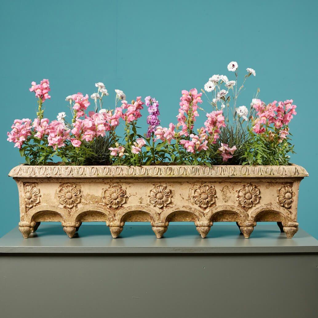 An early pair of Doulton & Co. antique window planters, made in the mid to late 1800s. Each stamped with ‘Doulton Lambeth’, stonewares of this design were included in the Doulton & Co. catalogue of 1893 (pictured) as a Mignonette Box, suggesting