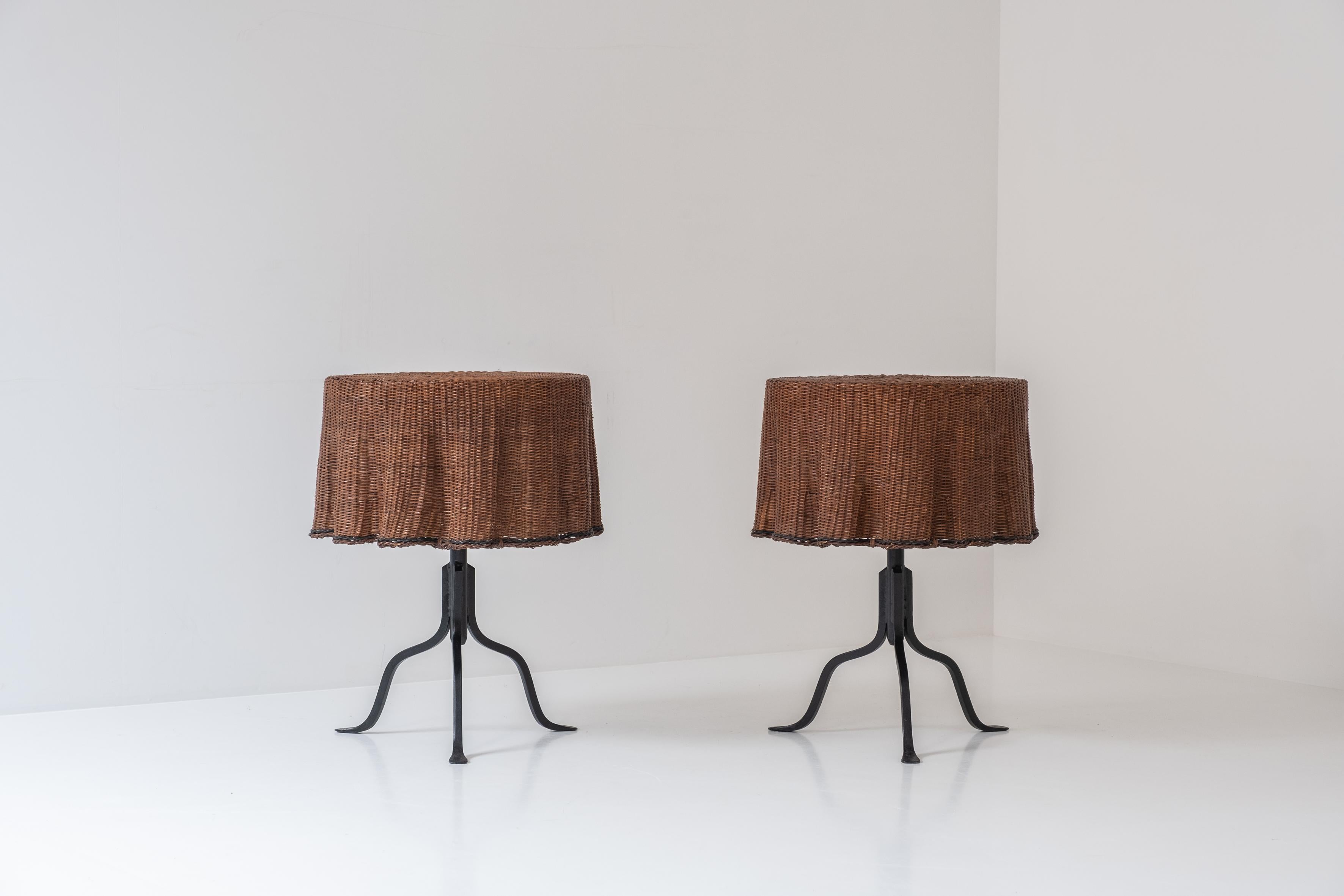 Rare set of 2 ‘Trompe L’Oeil’ wicker side tables with ‘draped’ illusion from France, designed and manufactured during the 1970’s. This table features a black lacquered iron base and rattan wickerwork. Both presented in its original and very good