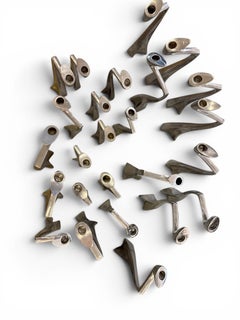 Rare set of 25 candelsticks by Matthew Hilton