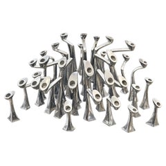Rare set of 25 candelsticks by Matthew Hilton