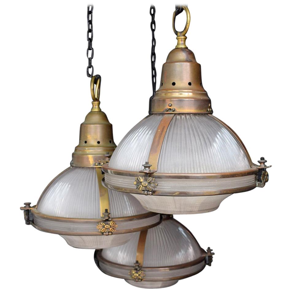 Rare set of 3 Holophane Glass Globe Pendant Lamps with brass fittings circa 1920