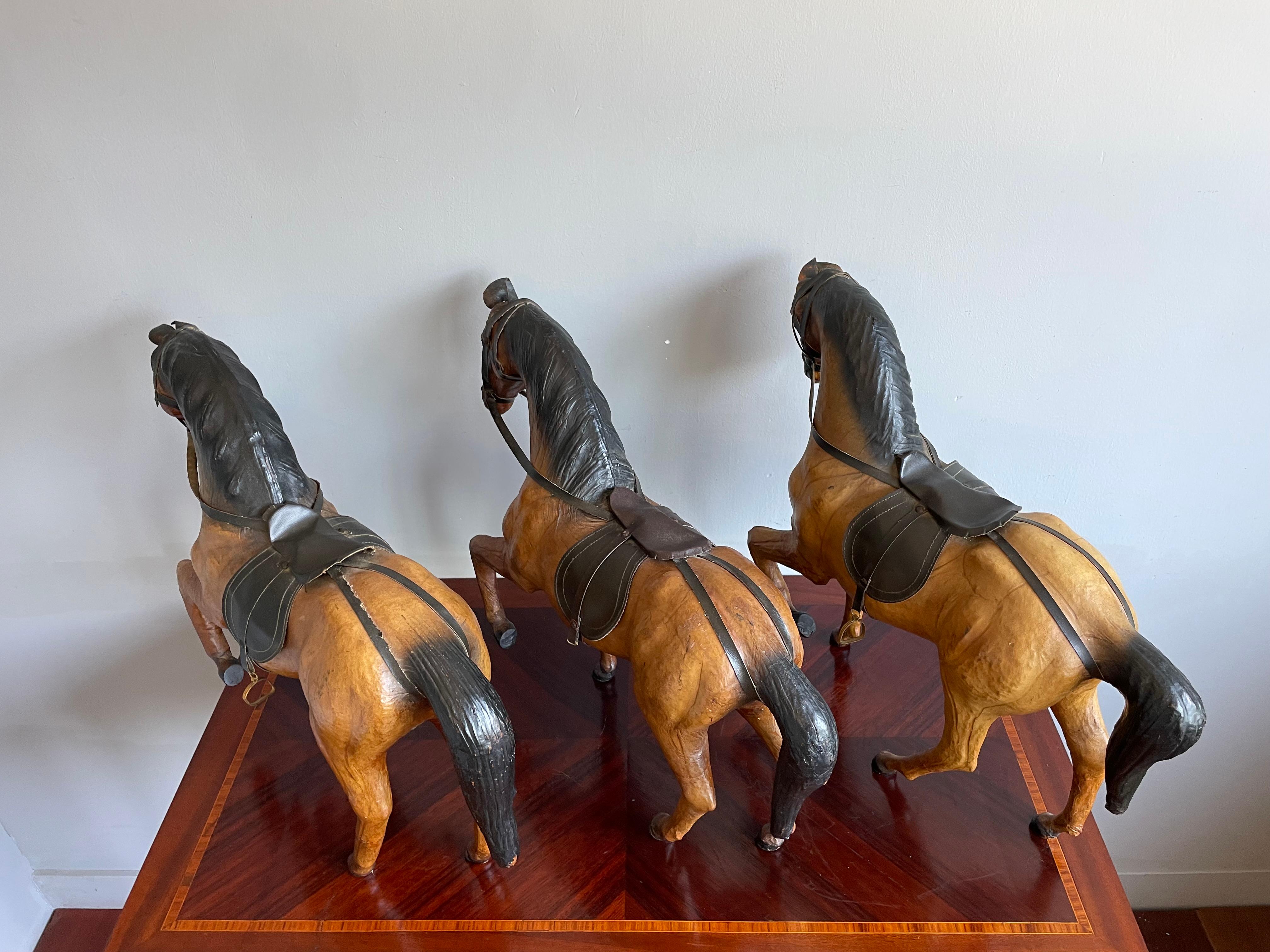 Brass Rare Set of 3 Midcentury Handmade Leather on Hand Carved Wood Dressage Horses For Sale