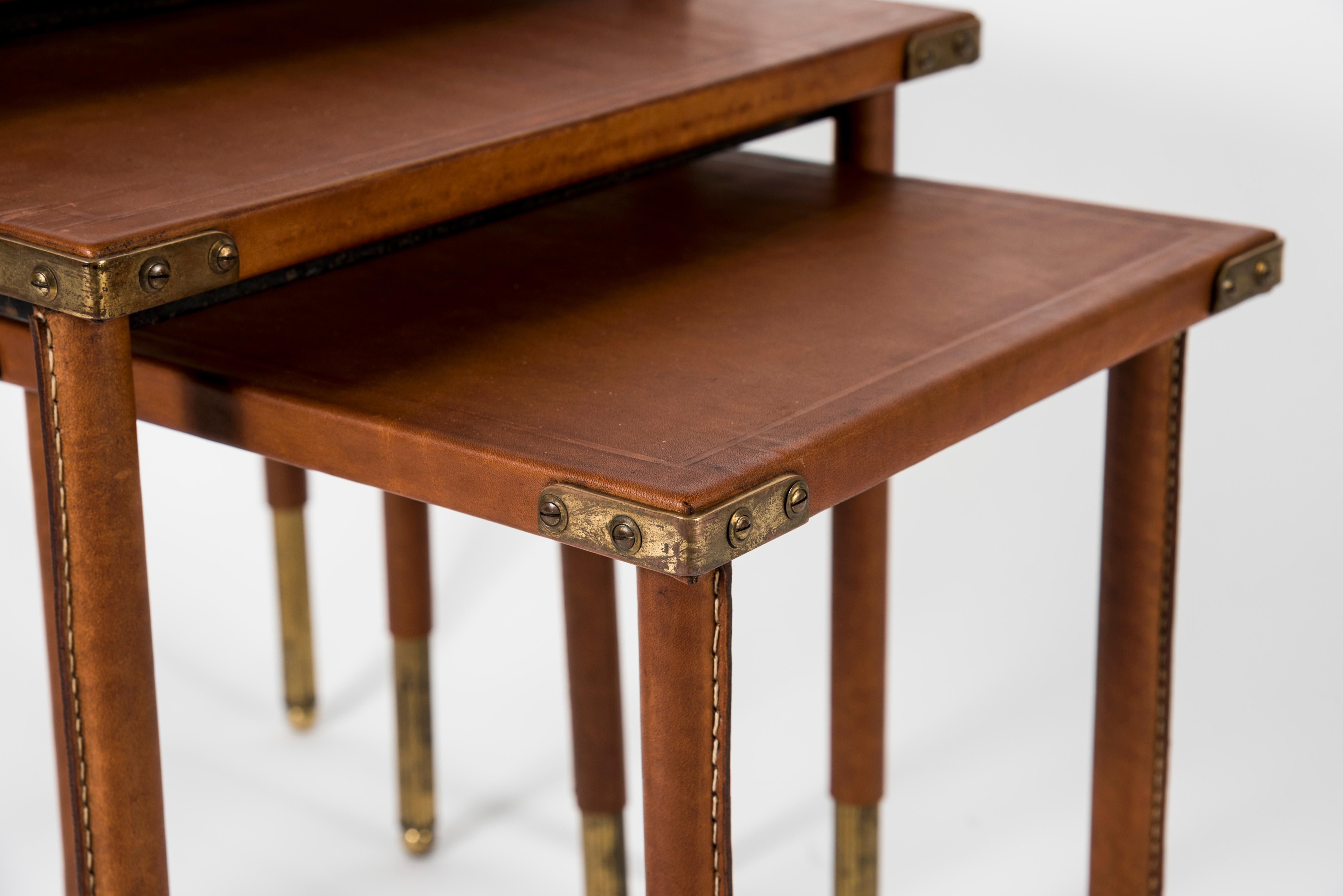 Mid-20th Century Rare Set of 3 Nesting Tables in Stitched Leather by Jacques Adnet