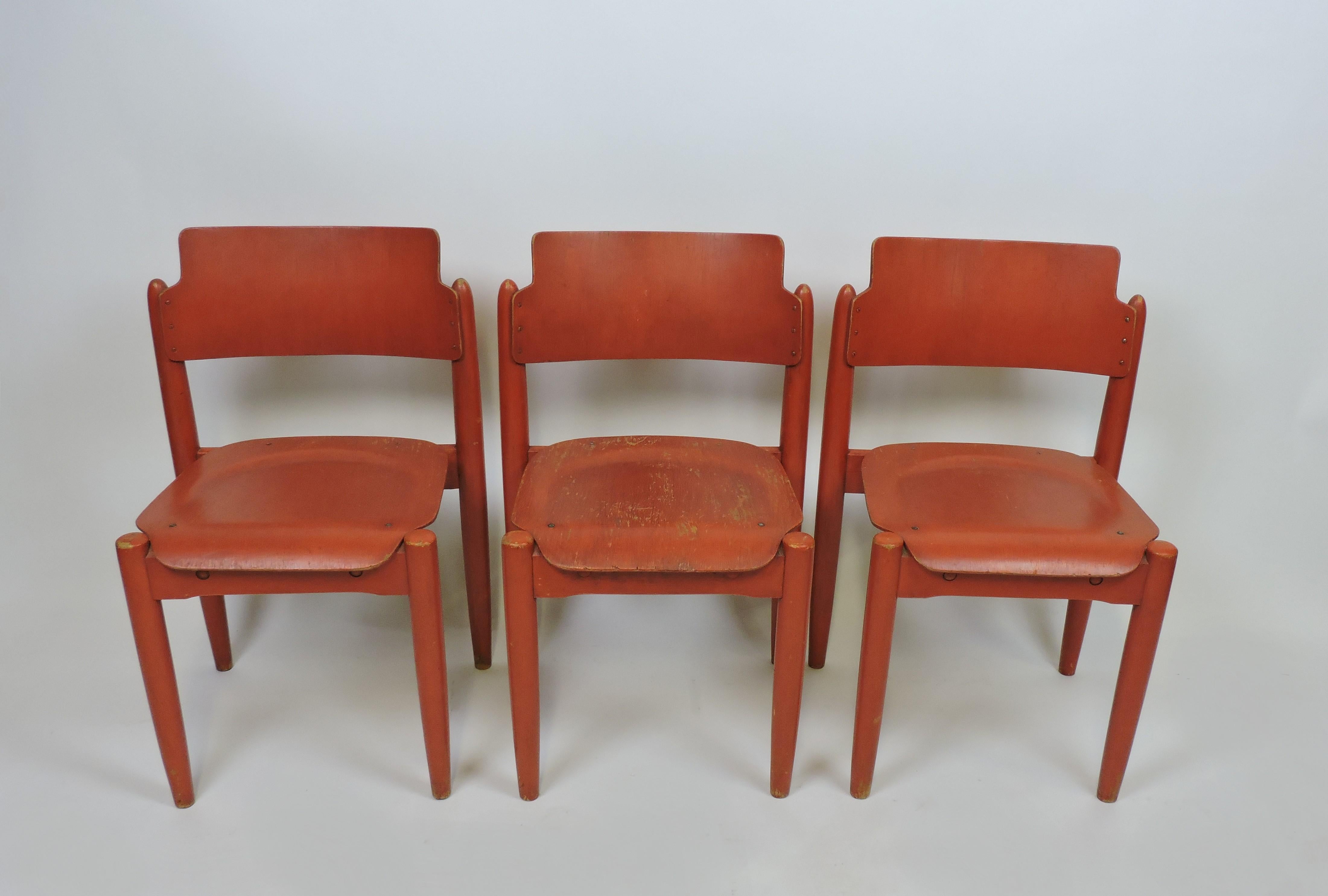 Set of 3 rare stackable Wilman chairs designed in 1956 by renowned Finnish designer, Ilmari Tapiovaara, and manufactured in Finland by Wilhelm Schauman Fanerfabrik. 
These innovative chairs are made with a bent plywood seat and back, and have nice