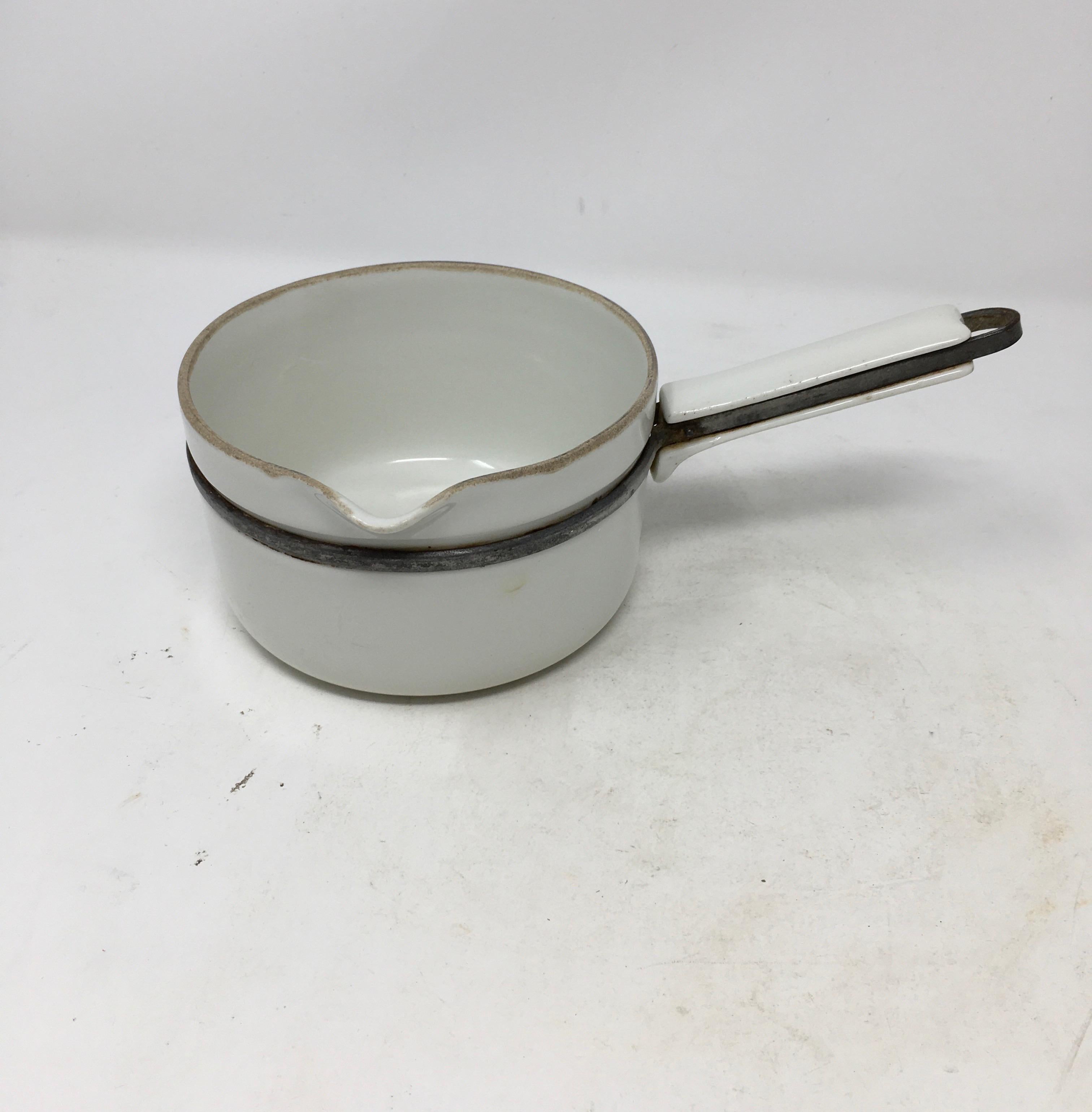 Rare set of 3 stamped Aluminite Frugier Limoges France Pots. Made of porcelain and steel.
These 3 pans are porcelain or aluminite, and can be placed on the fire. They have also porcelain handles which is rare.

Measures: Smallest 9