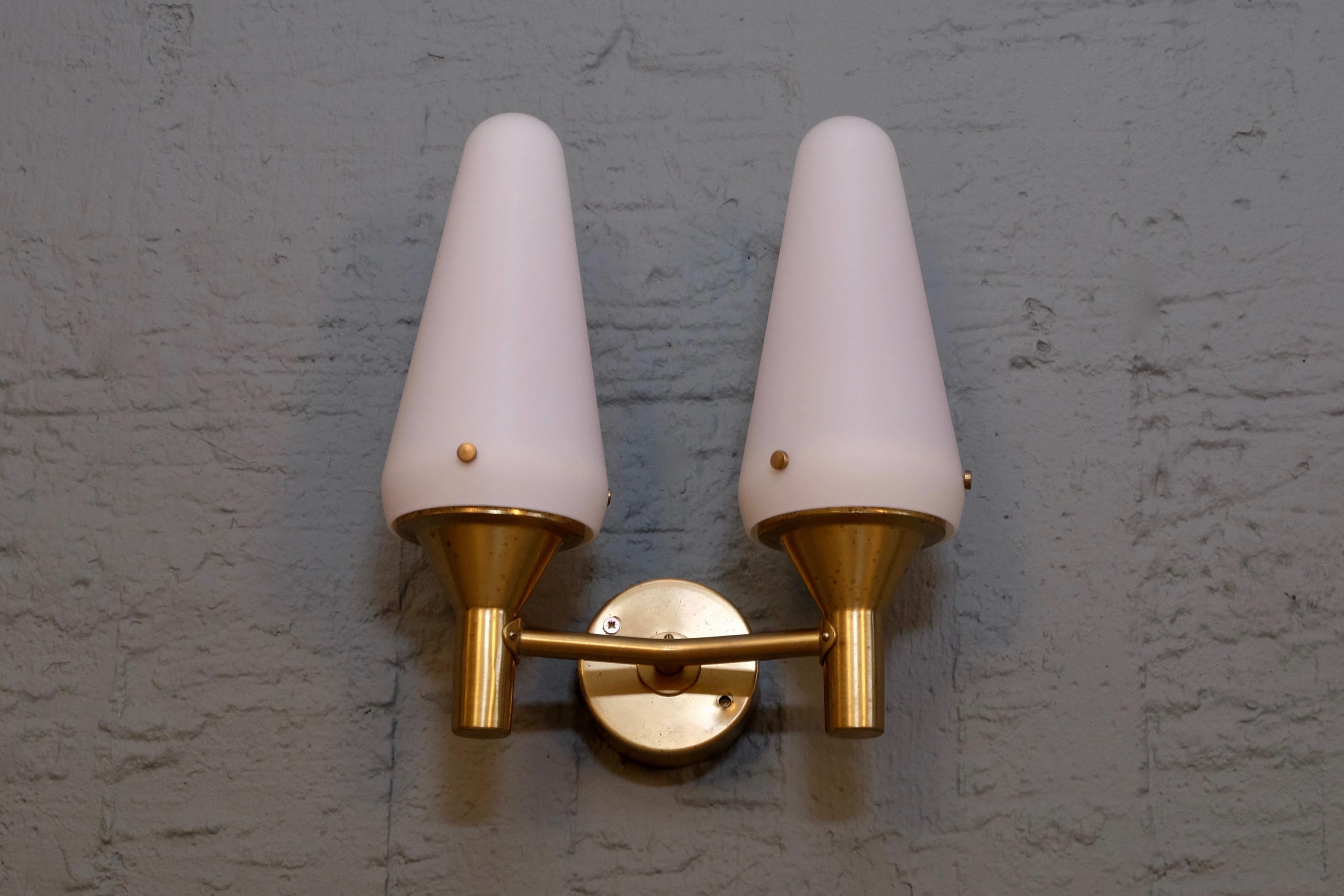 Rare wall lamps model S-1554 designed by Hans-Agne Jakobsson
Produced by Hans-Agne Jakobsson in Markaryd, Sweden, 1950s
Brass and white opal glass.

Quantity: 4 available, listed price is for one (1) wall lamp.