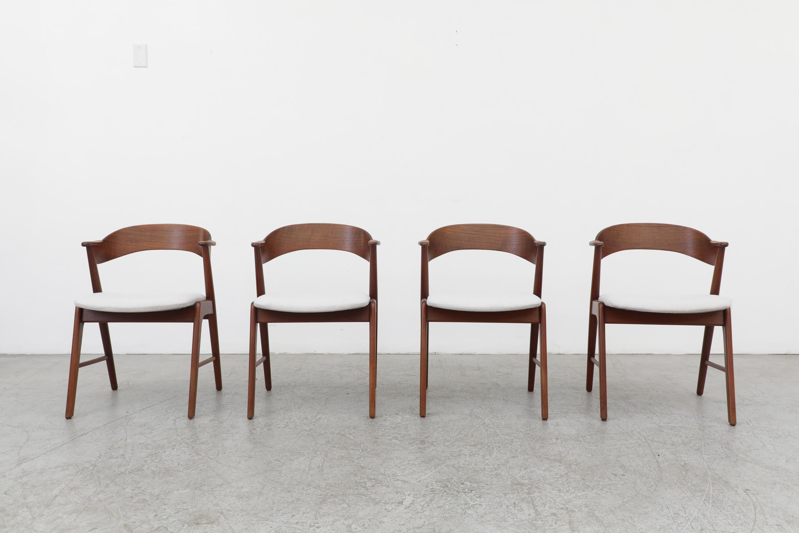 Rare set of 4 model 32 Kai Kristiansen chairs for Schou Anderson, 1960s. Set of 4 dining chairs with teak frames and curved ribbon-like seat backs. Frames are in good original condition with some sun fading to the teak and newer upholstery from