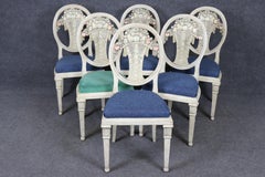 Rare set of 6 Directoire Dining Chairs with Elaborate Carved Backs