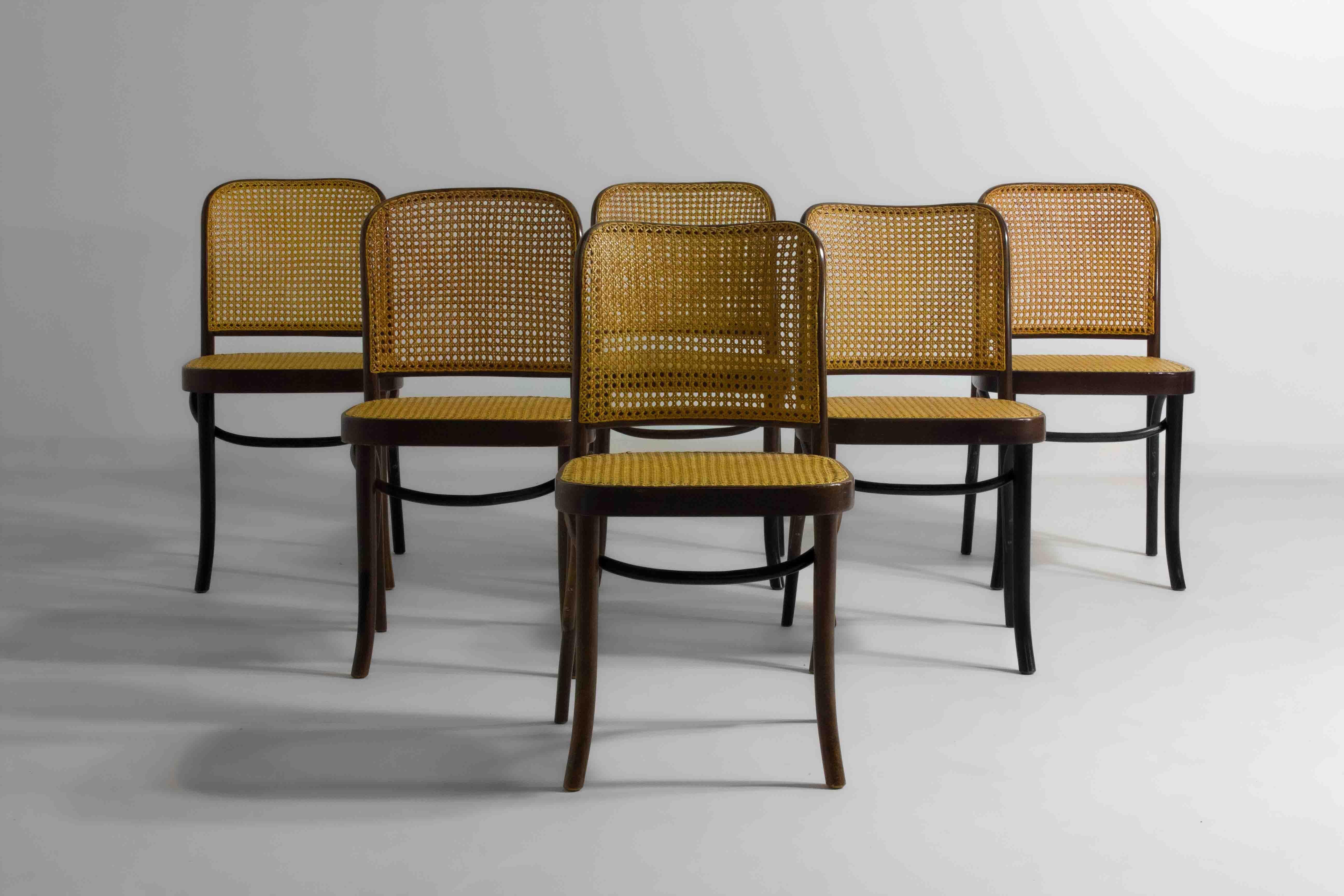 The 811 Chair, designed by Josef Hoffmann and produced by Thonet, was introduced in the 1920s. It features a caned seat and backrest set within a curved, bentwood frame, a method Thonet was renowned for perfecting. Josef Hoffmann, an influential