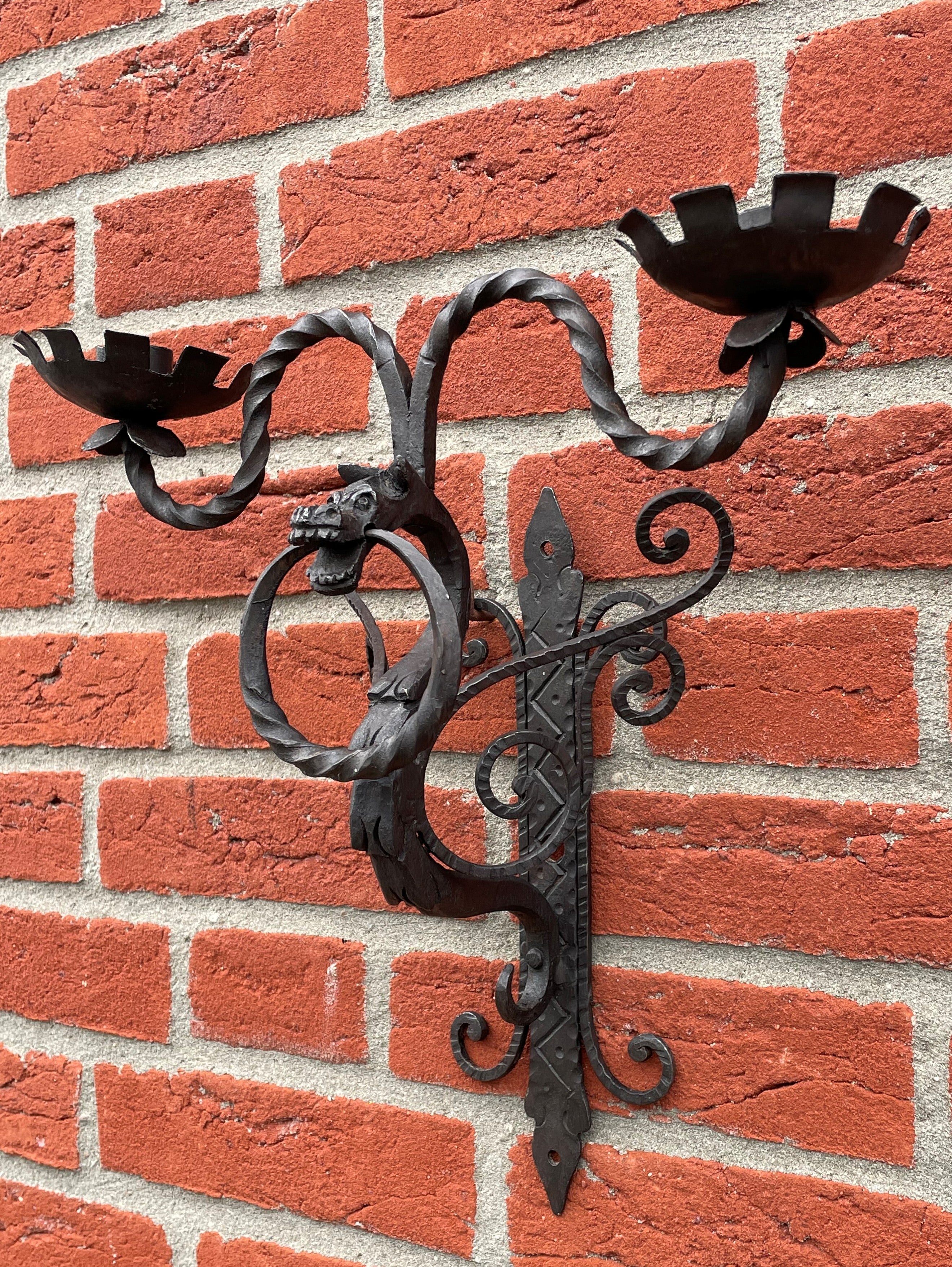 Stylish and highly decorative set of Medieval Style candle sconces.

With early 20th century Gothic Art as one of our specialities, we have seen and sold a lot of great and unique pieces, but never did we come across a set of seven hand forged