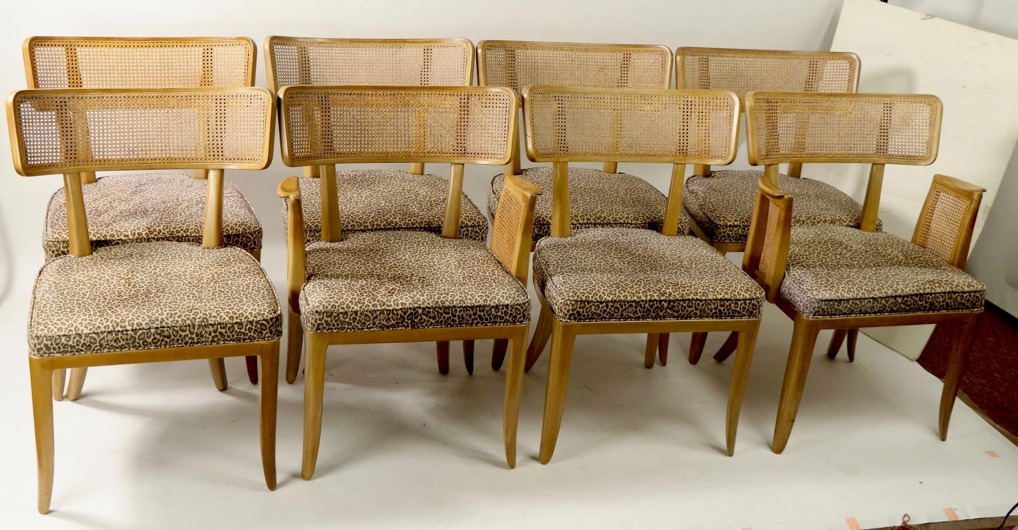 Rare set of 8 cane back dining chairs designed by Edward Wormley for Dunbar. This set includes 6 armless (model 4580) and 2 armchairs. The chairs are in original bleached mahogany finish, the seats were recovered by the original owner in the 1960s.