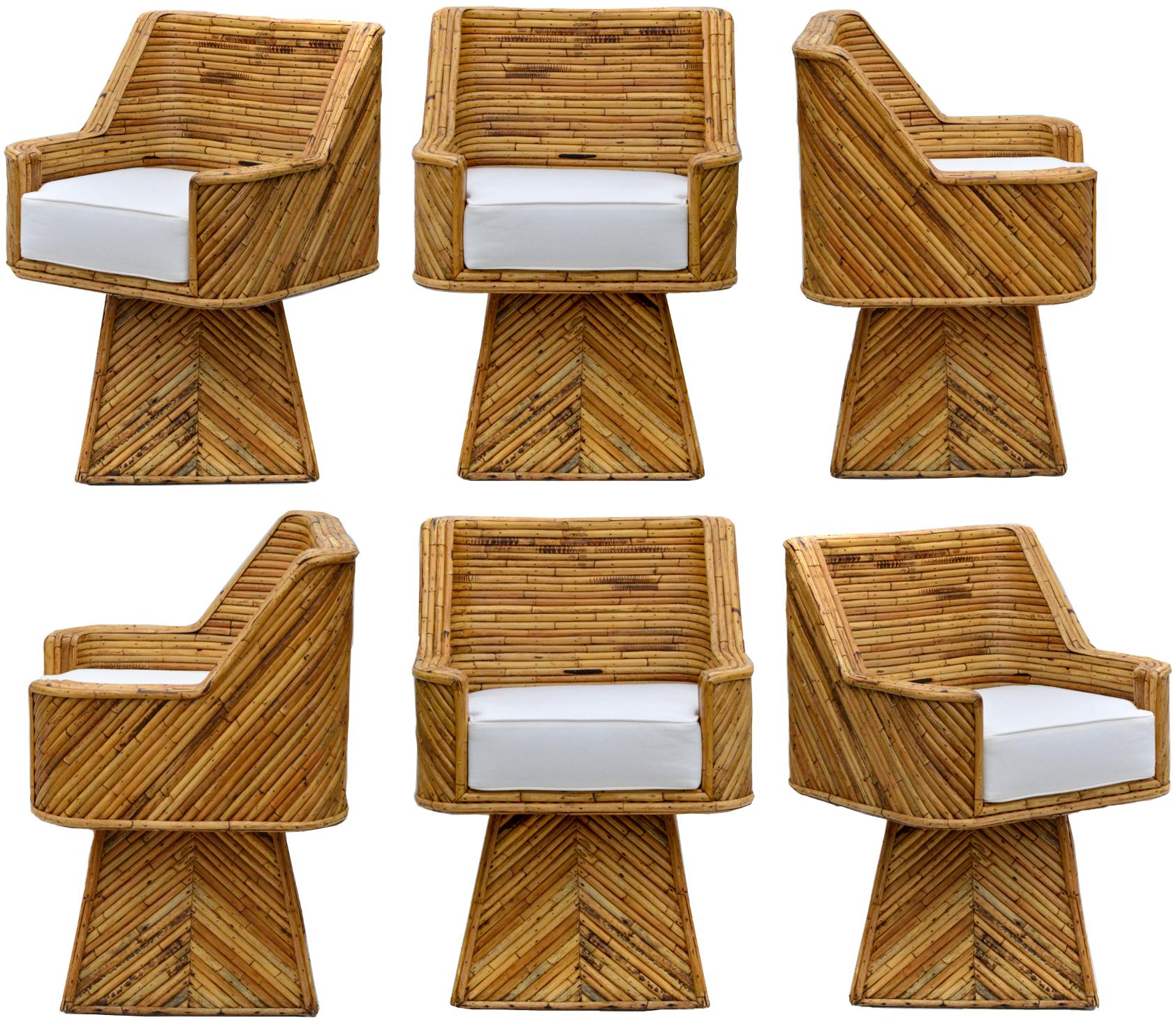 An exceptional and rare set of bamboo reeded swivel chairs. The chairs are masterfully constructed and have kept very well. Recently gone over and gently reconditioned throughout all reeded surfaces, the set will supply a very strong style backdrop