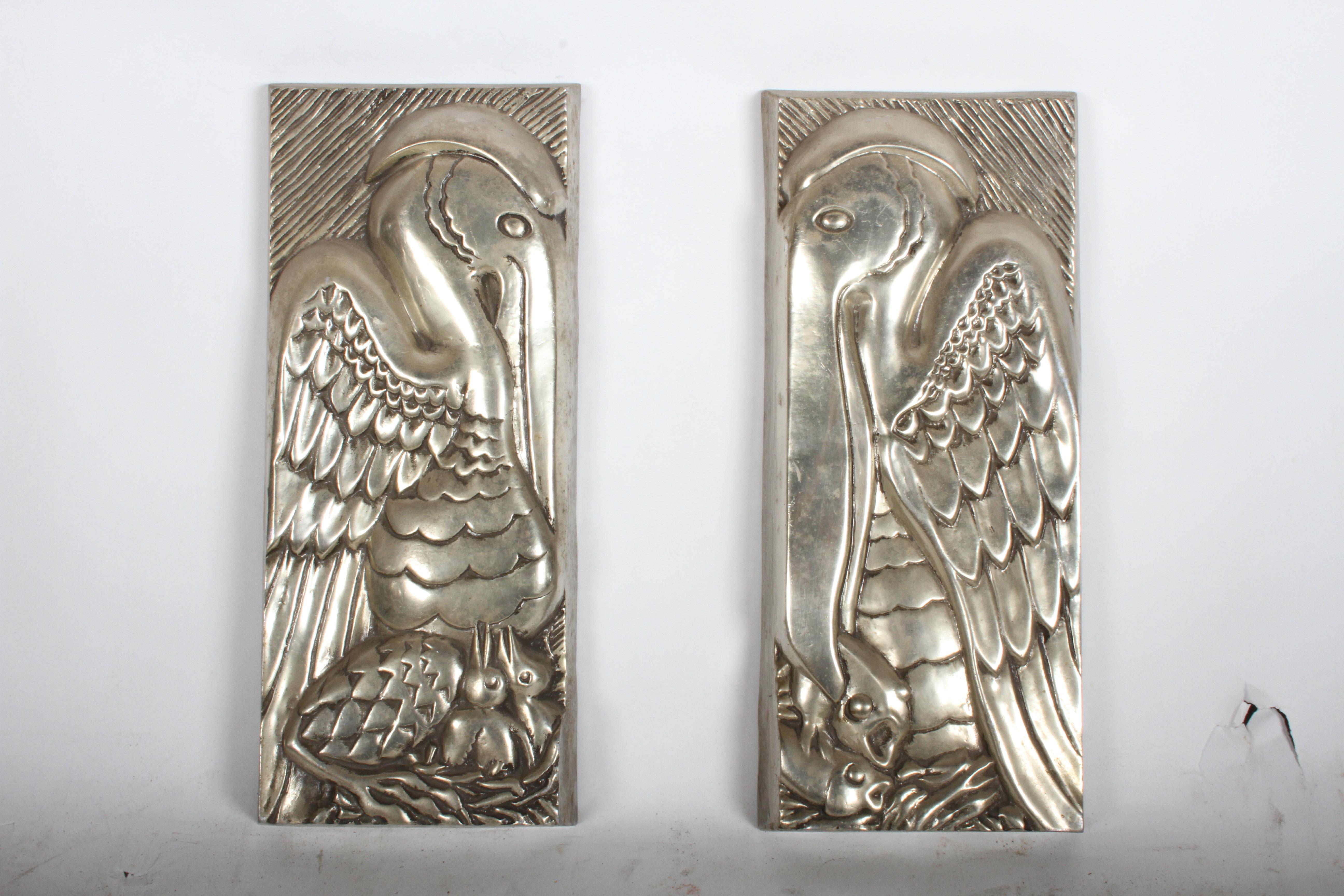 Rare and early Bruce COX Art Deco panels in aluminum done in relief. Pelicans with babies in their nest, plus catching fish. These pieces were made in the late 1930s or 1940s, when he focused on exotic nature themed pieces, in the 1950s-1960s he