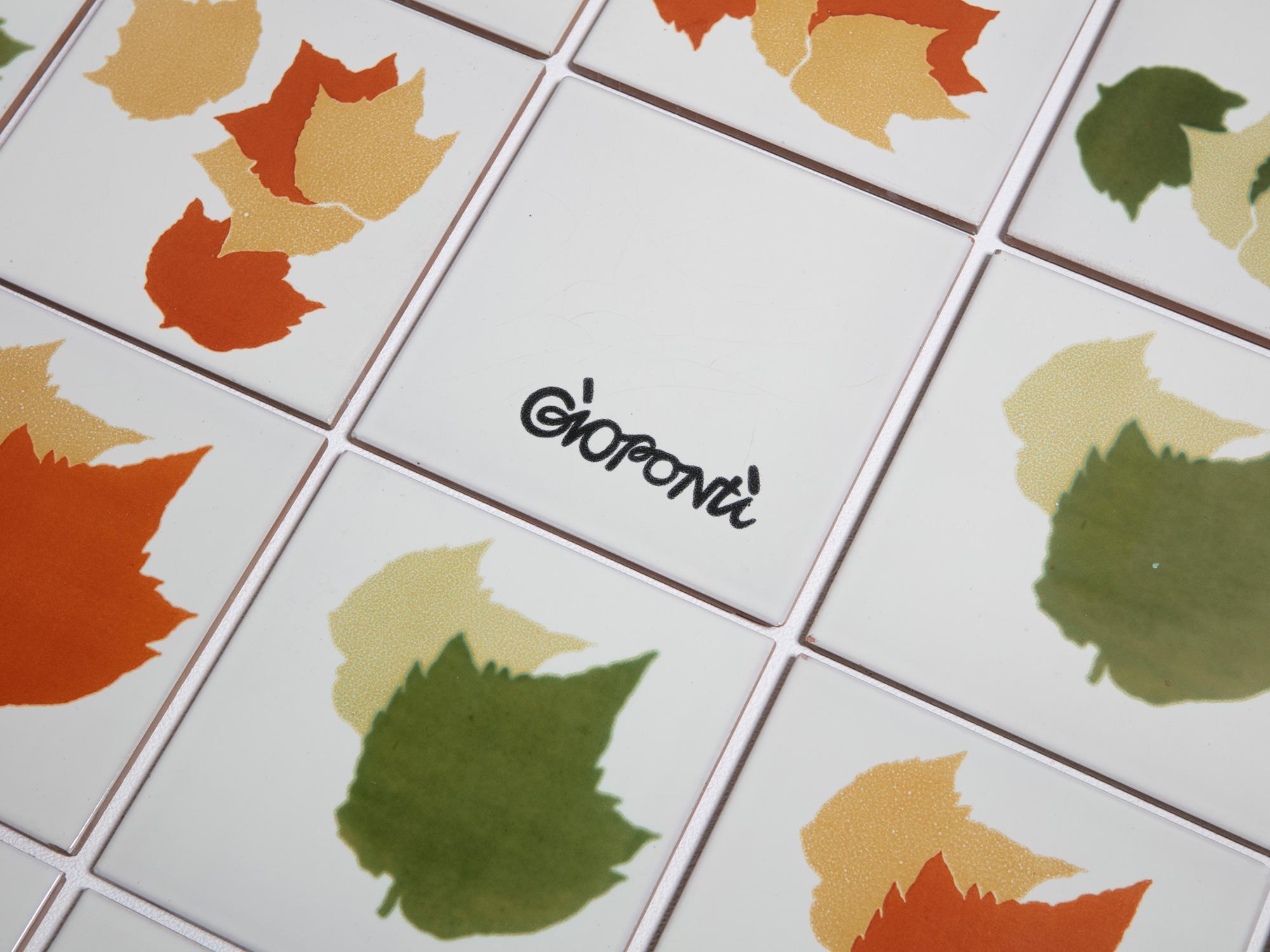 Rare set of ceramic tiles by Gio Ponti for Ceramica D'Agostino.
A bunch of leaves with different size and autumn and spring colors.
80 colored pieces can be combined with additional white tiles.