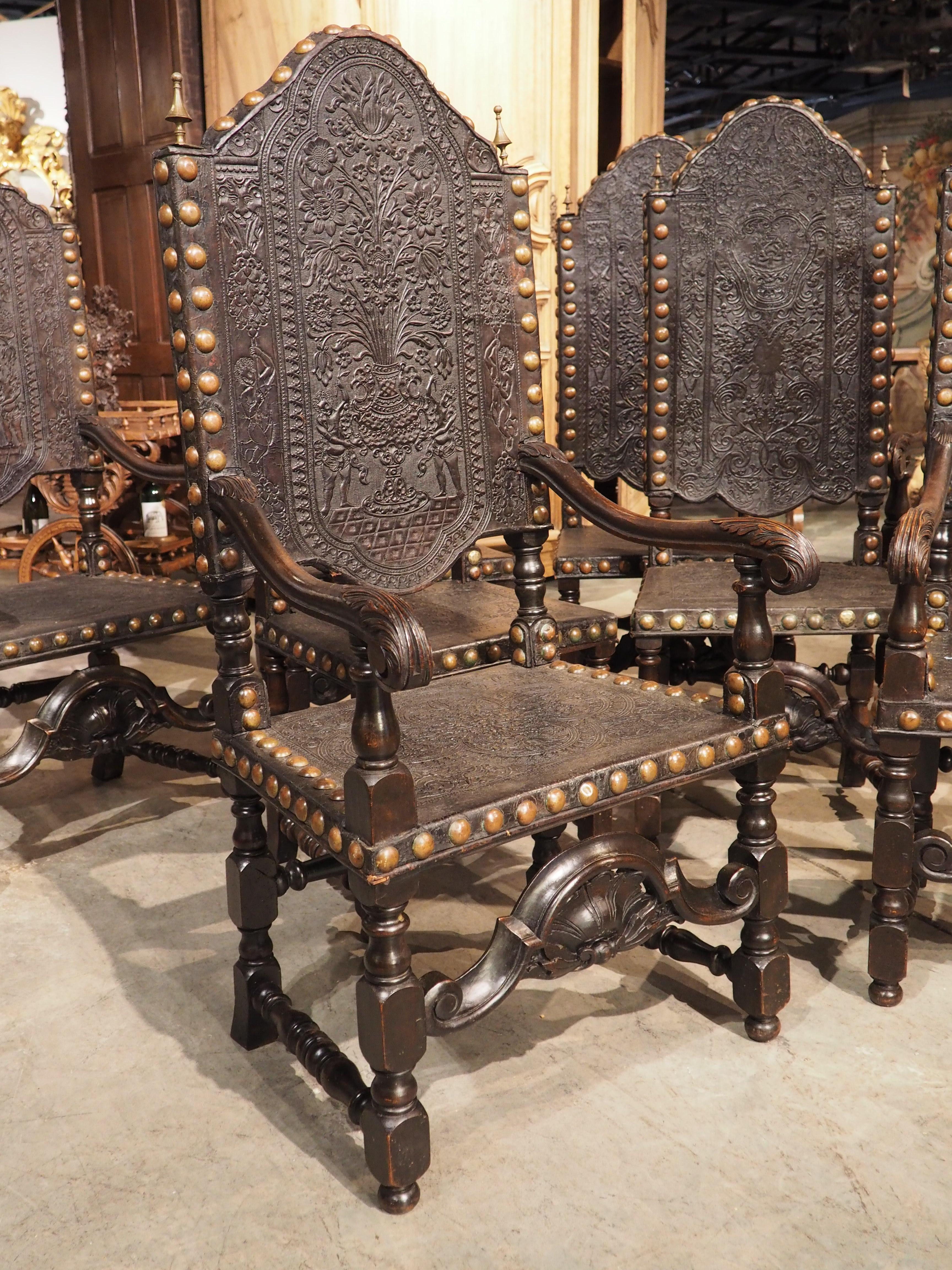 Hand-Carved Rare Set of Eight 19th Century Spanish Embossed and Studded Leather Chairs
