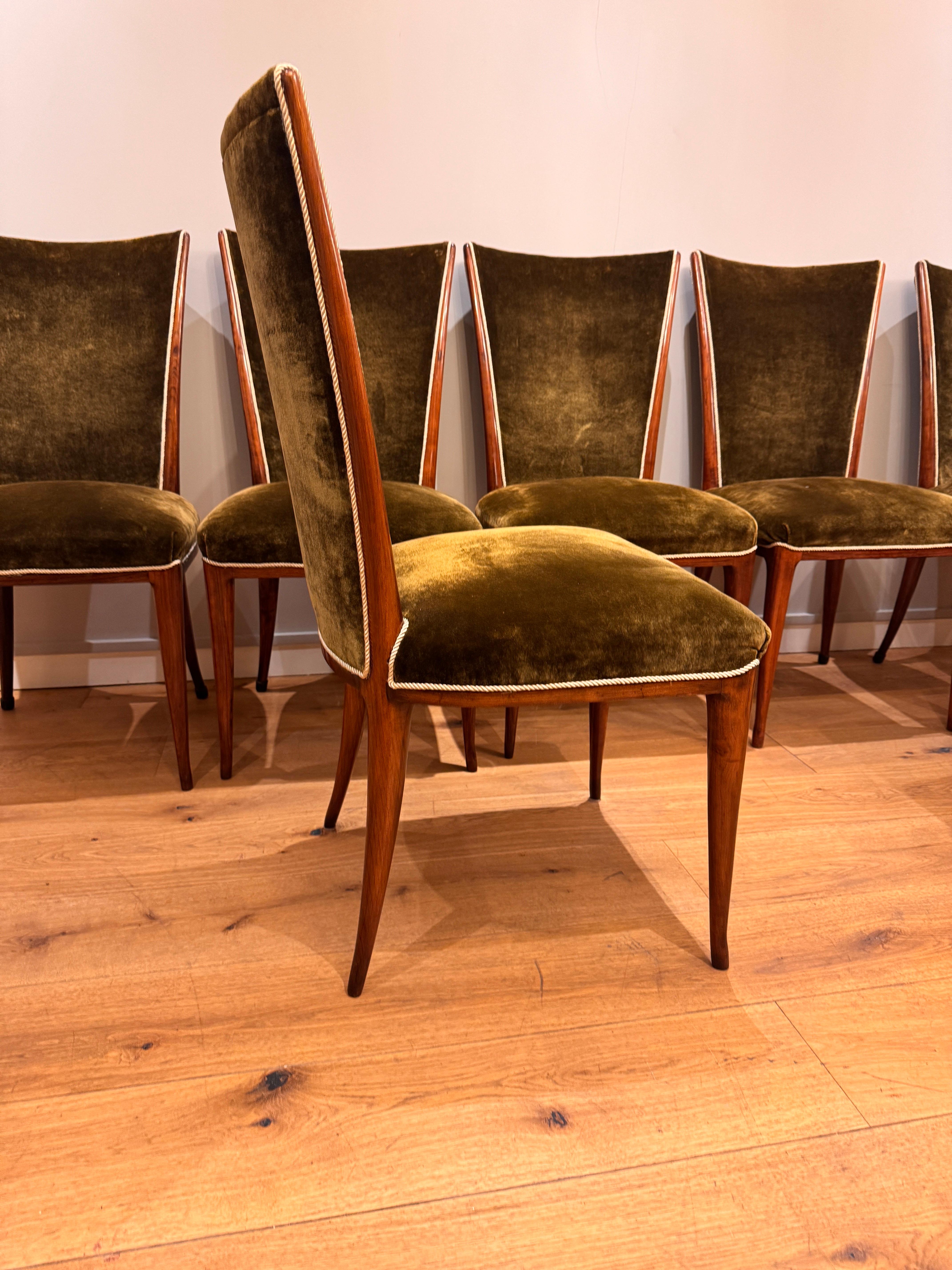 A very rare set of 8 dining room chairs designed and produced by Osvaldo Borsani C1940s . Solid cherrywood frames later upholstered in luxurious mohair moss green velvet with contrasting piping . 
A large dining table to accommodate these chairs is