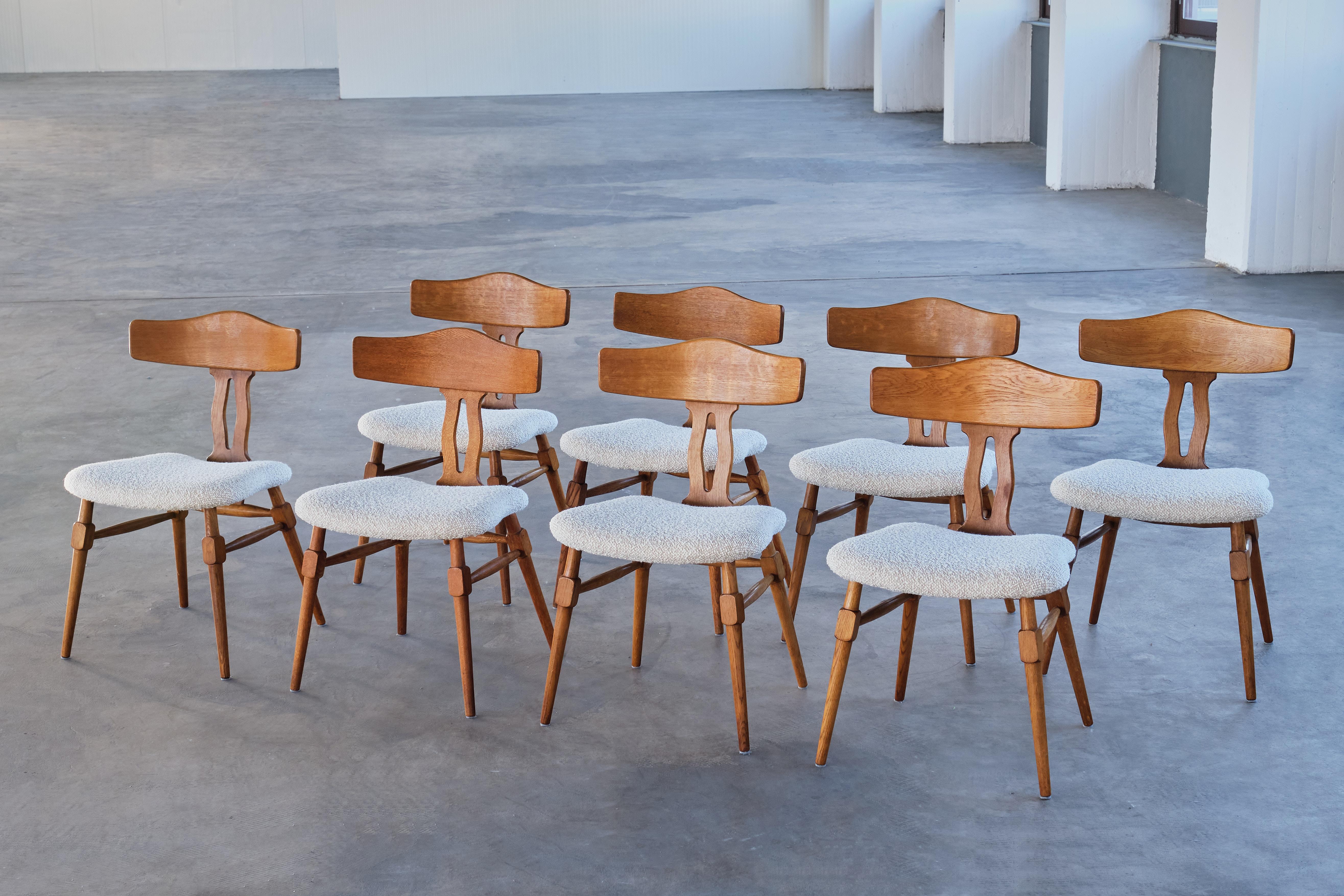 This rare set of dining room chairs was designed by Henning (Henry) Kjærnulf in the late 1950s. The chairs were produced by Nyrup Møbelfabrik in Denmark.  

The set consists of eight chairs made of solid oak with a beautiful grain and colour. The