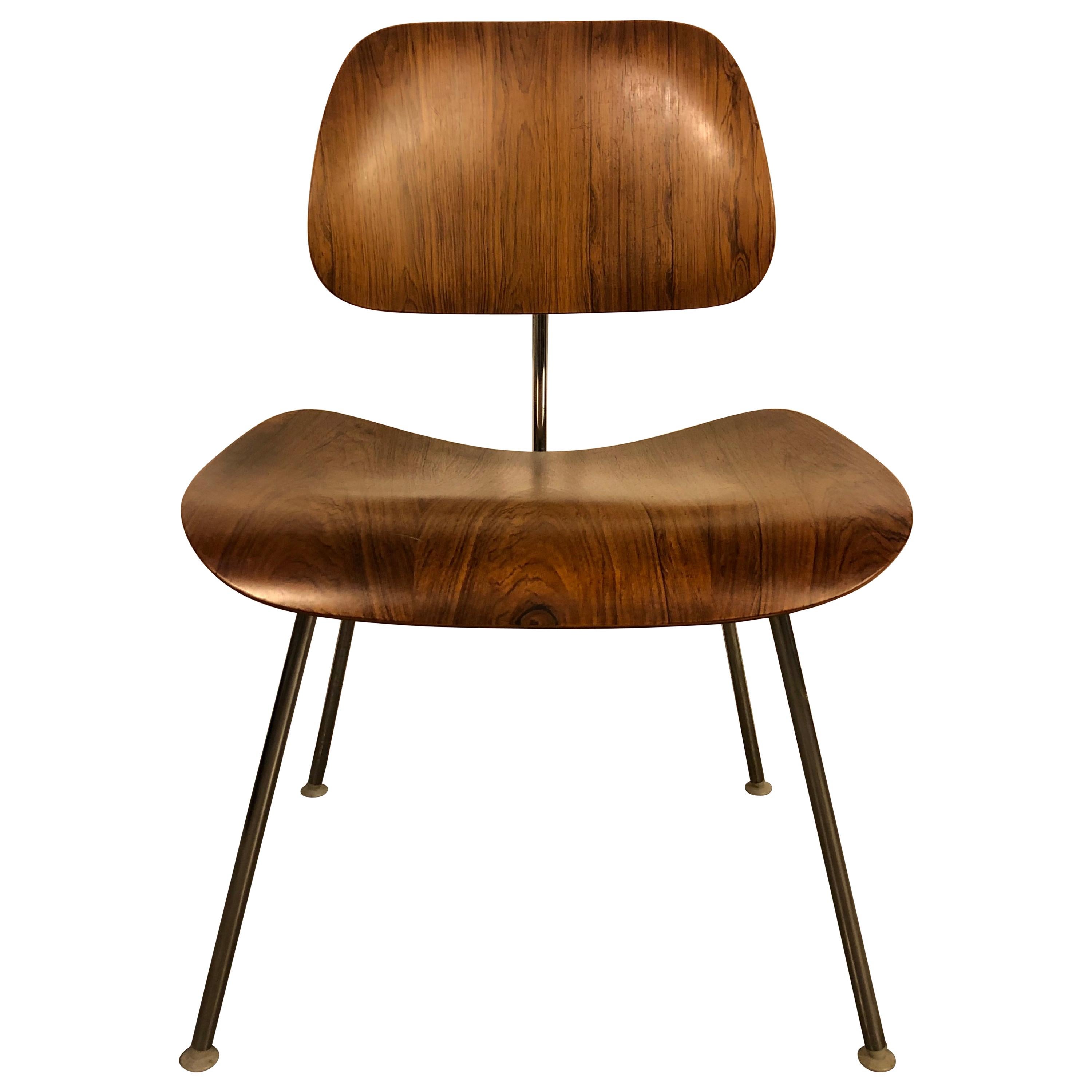 Gorgeous set of original Eames for Herman Miller DCM dining chairs in rosewood. All chairs signed. Rosewood was a special order option and it is extremely rare to find more than 1-2 at a time, and especially an original set. Wonderful and rich