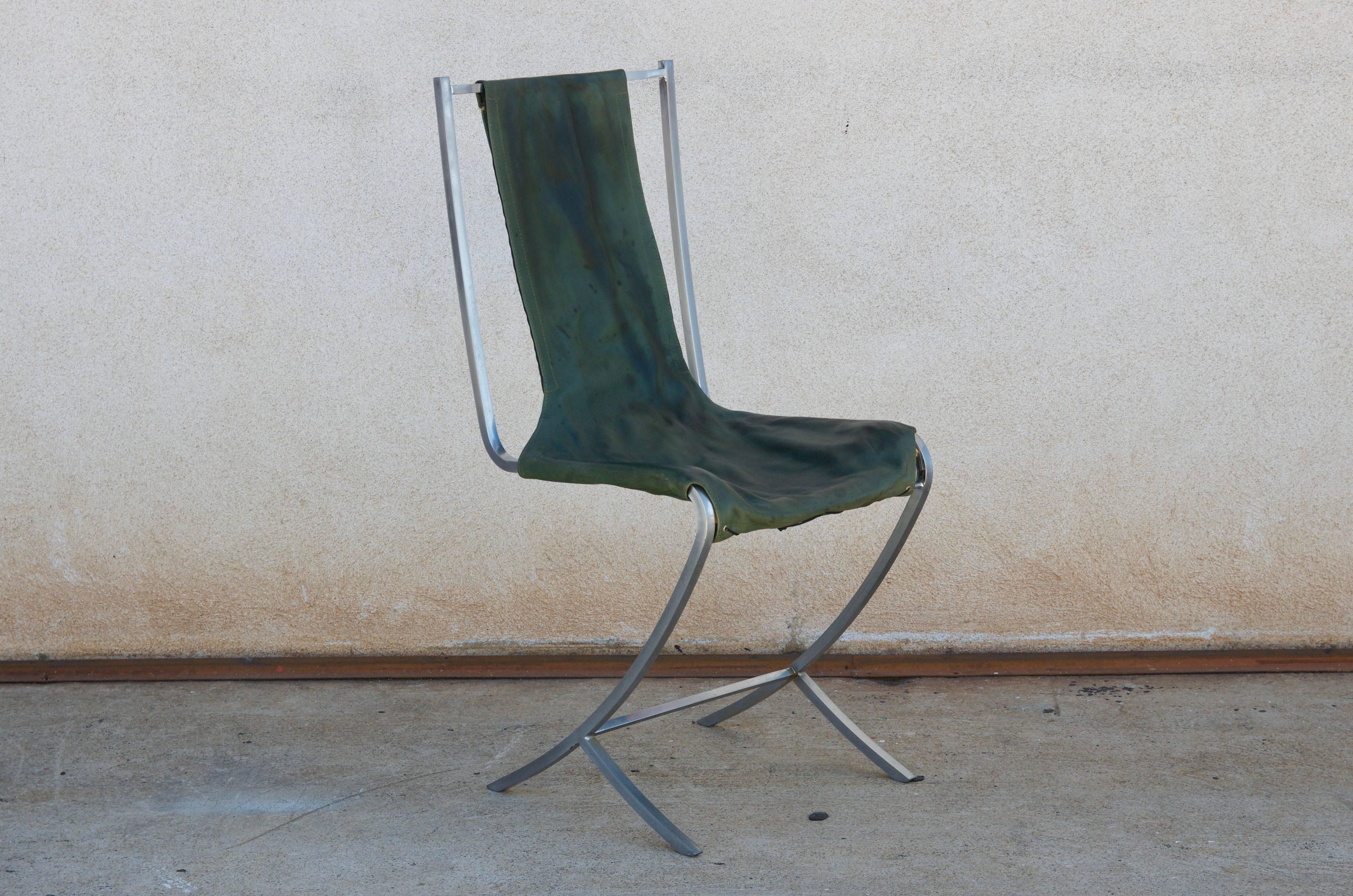 Rare set of five stainless steel (acier inoxydable) chairs by Maison Jansen. Manufactured by Usinox. Original green leather seat and back covers that need to be replaced with C. O. M. (6 yards).

Great as a set of five around a round table. Also