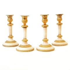 Rare Set of Four Almost Identicial Gilt Bronze Candlesticks with Marble Base