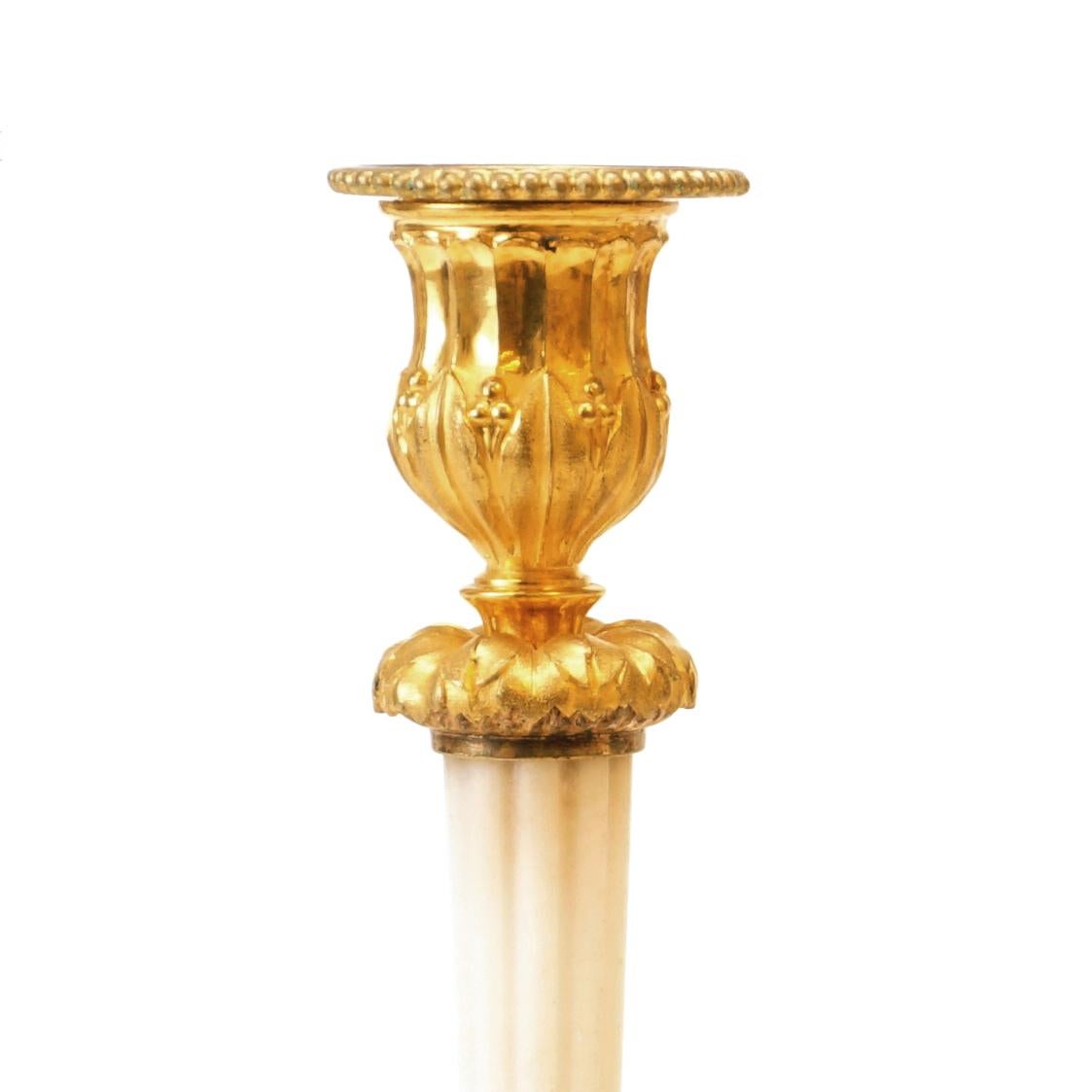 Empire Rare Set of Four Almost Identicial Gilt Bronze Candlesticks with Marble Base For Sale