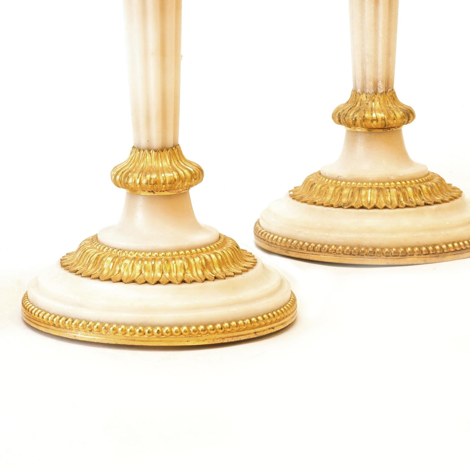 French Rare Set of Four Almost Identicial Gilt Bronze Candlesticks with Marble Base For Sale