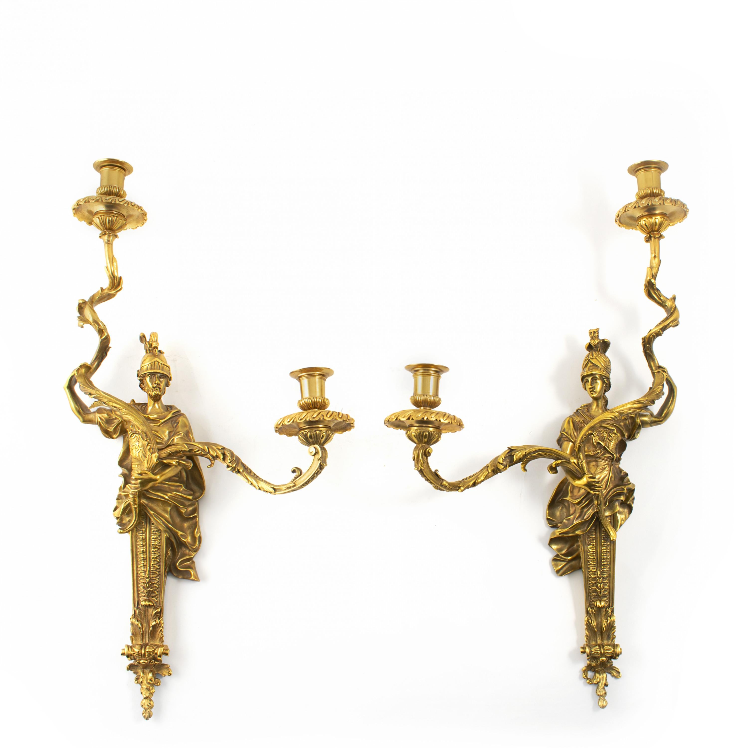 A refined set of four French Louis XVI style gilt bronze wall lamps.
Made in France in the late 19th century by Henri Vian.
Very high quality.

Each fitted with two lights held by a bronze sculpture.

Measure: Height: 61 cm.
Sold as a set of four.