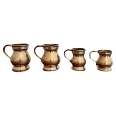 Raro juego de cuatro antiguas jarras victorianas de campana