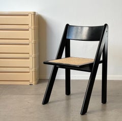 Raro juego de cuatro de madera lacada en negro y ratán, Italia años 60