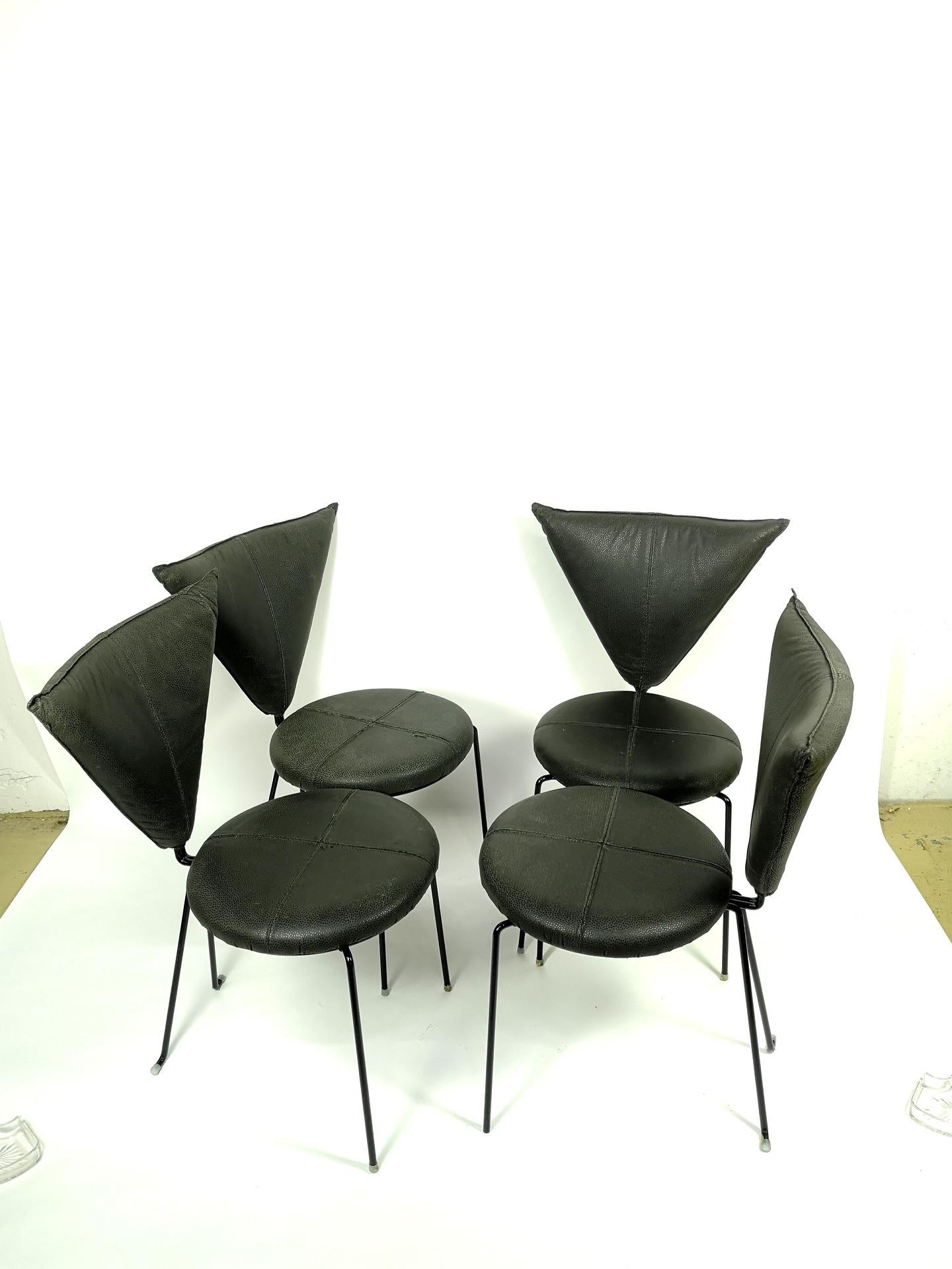 A rare set of four black leather dining chairs with painted black steel legs. Made in Germany, circa 1980s. Designed by Helmut Lubke & Co.
 